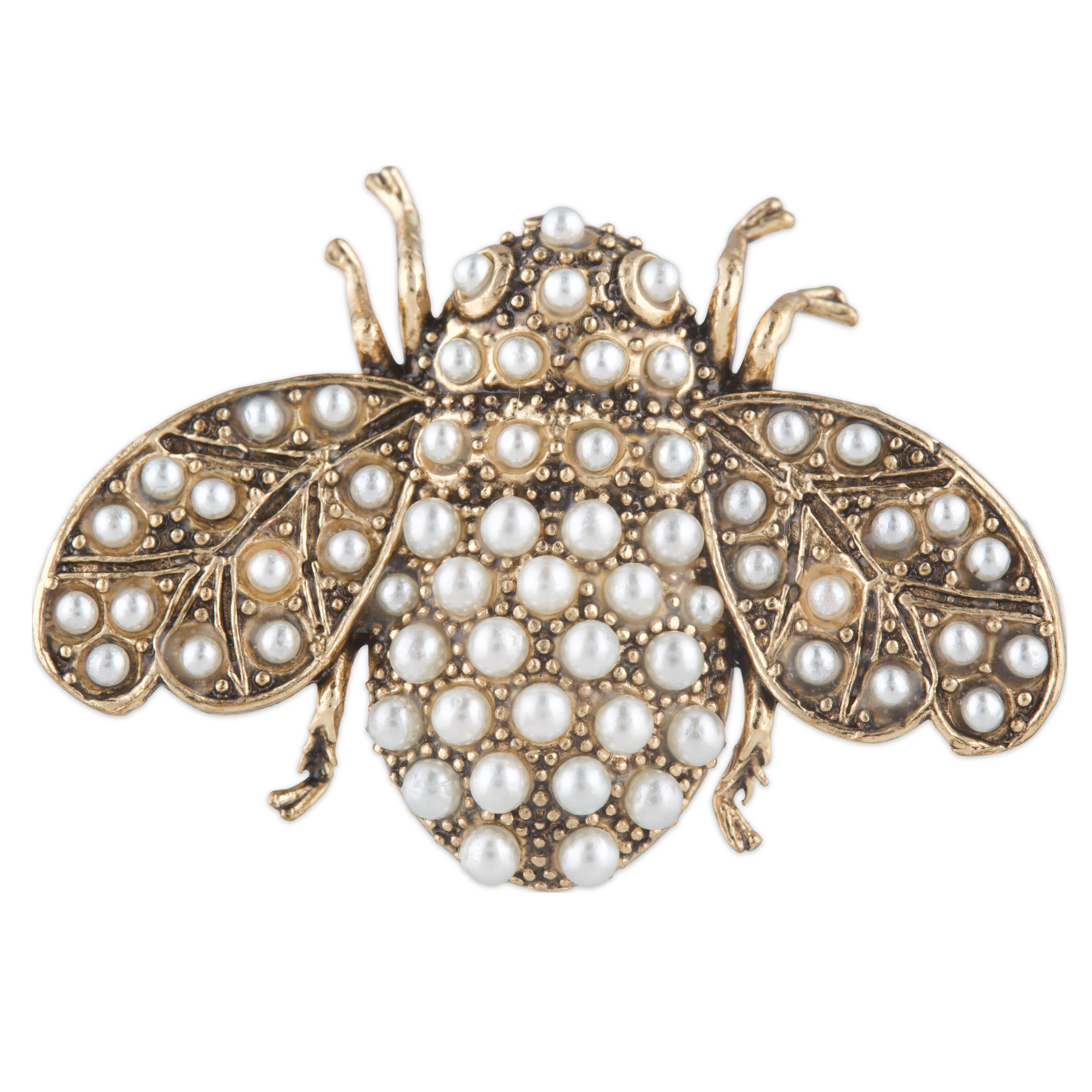 Gold insect-shaped brooch with pearl embellishments on a white background