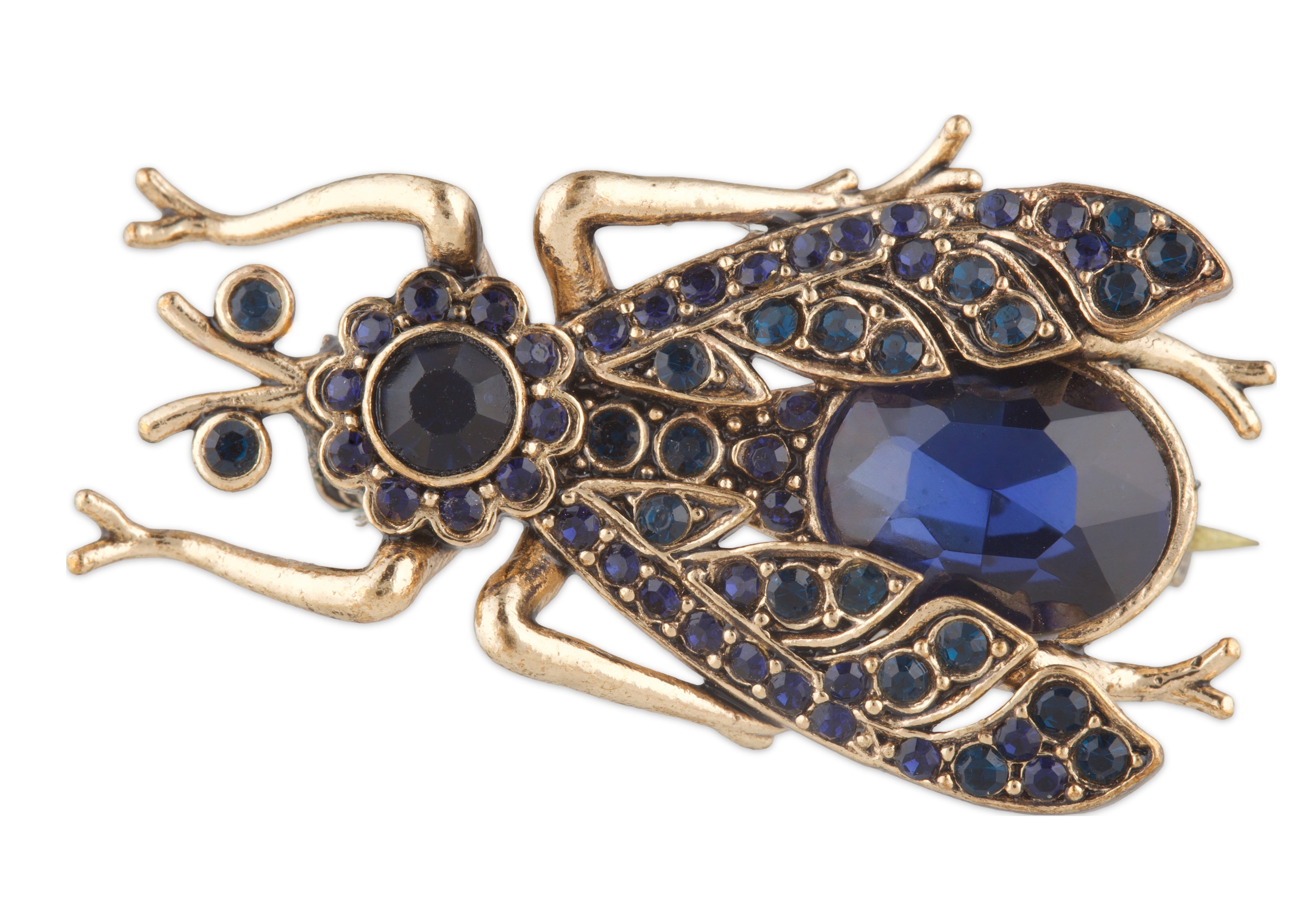 Gold frog brooch with blue gemstones on a white background