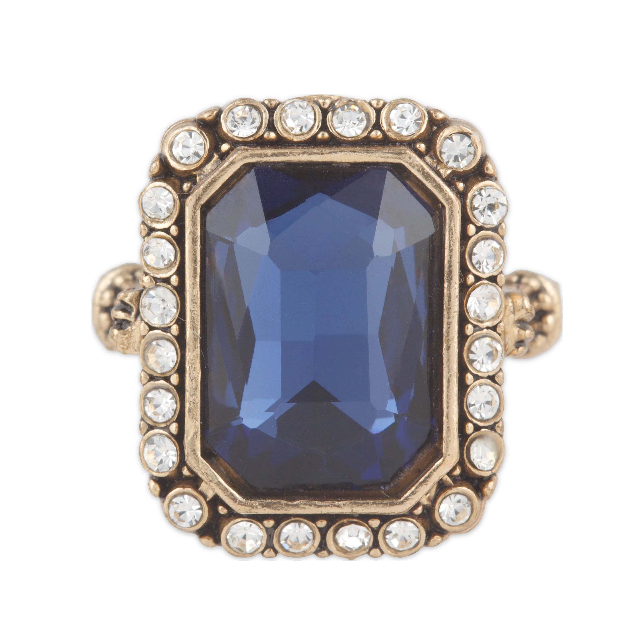 Ring with a blue gemstone and gold accents on a white background