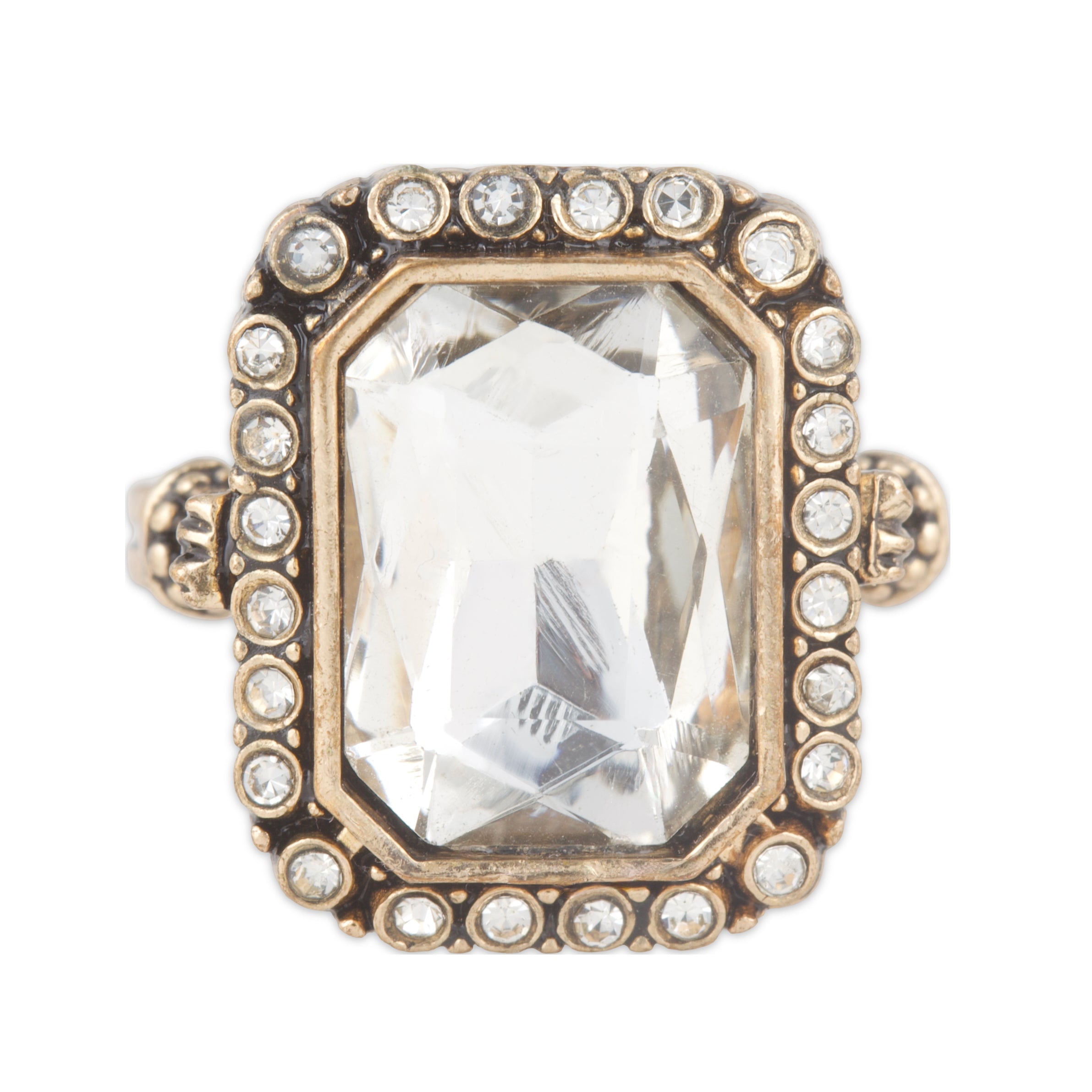 Ring with a large central gemstone and smaller stones around on a white background