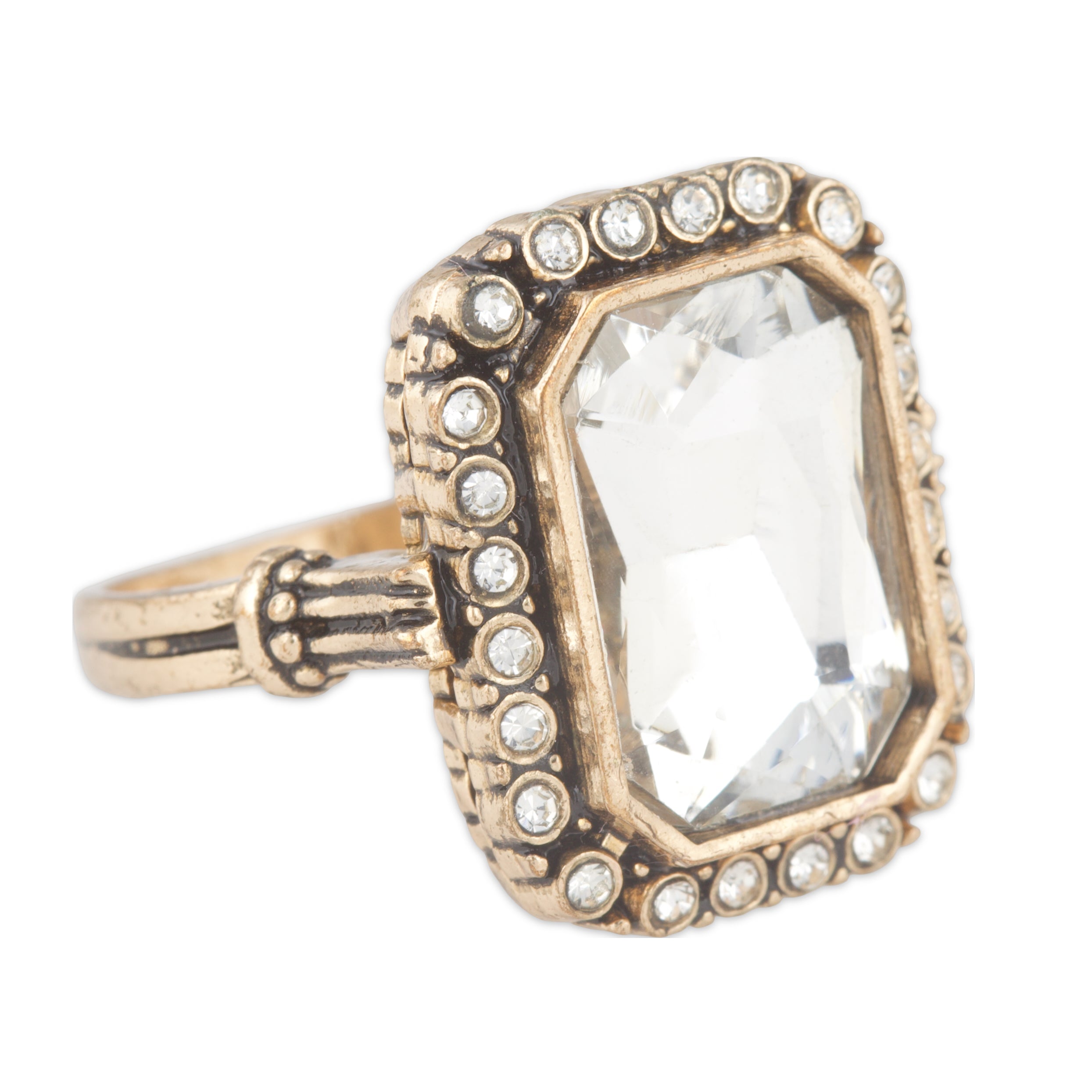 Gold ring with a large central gemstone and smaller stones on a white background