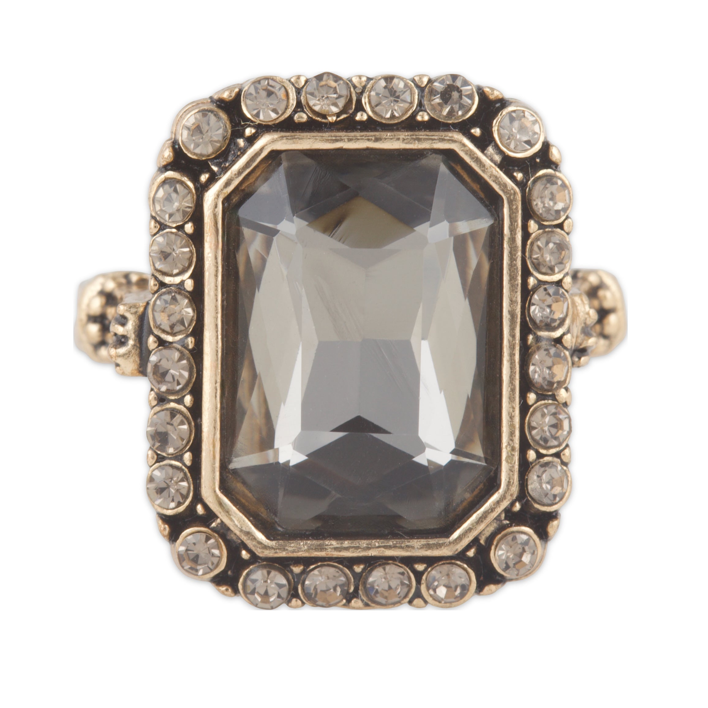 Ring with a large central gemstone and smaller stones around on a white background