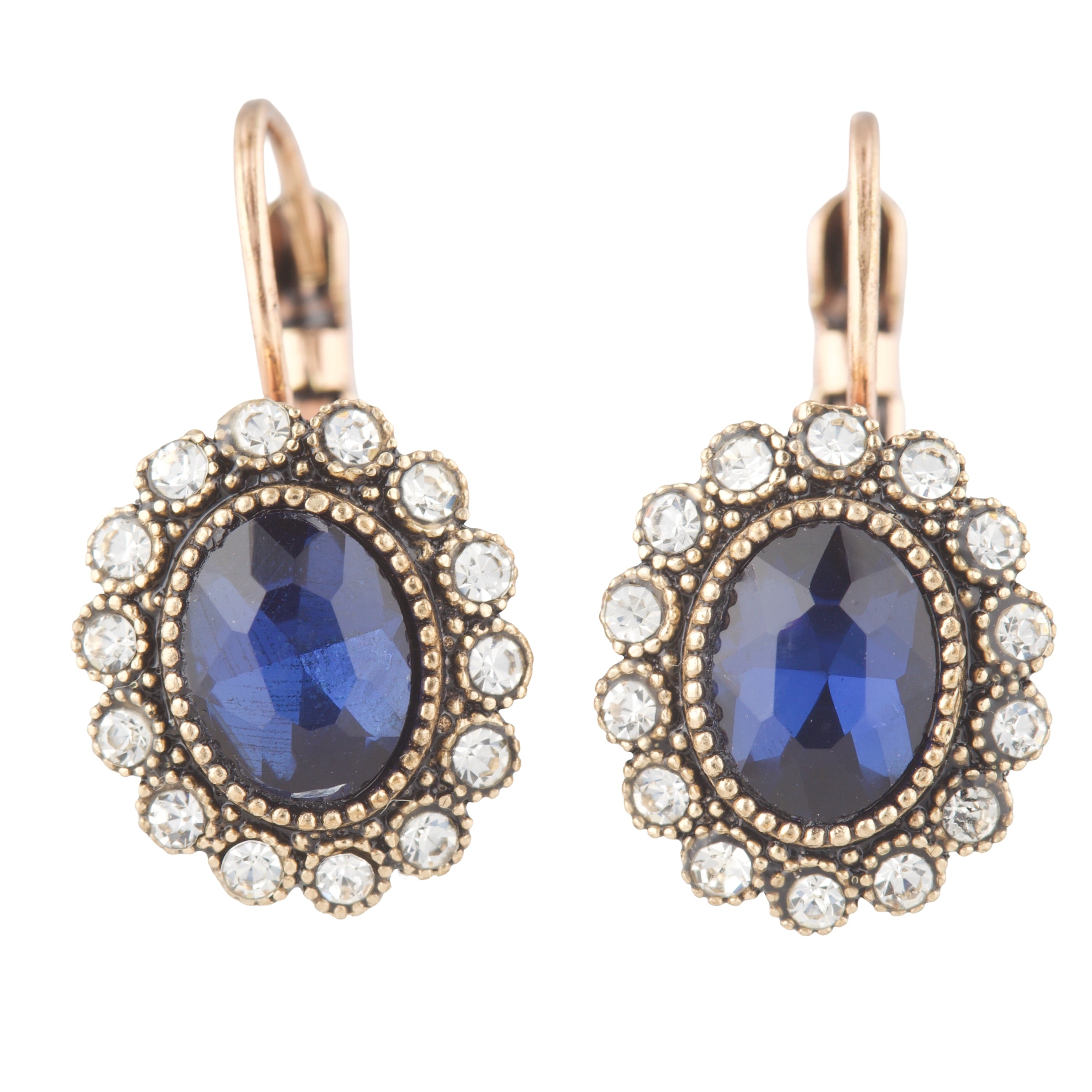 Pair of earrings with blue gemstones and rose gold accents on a white background