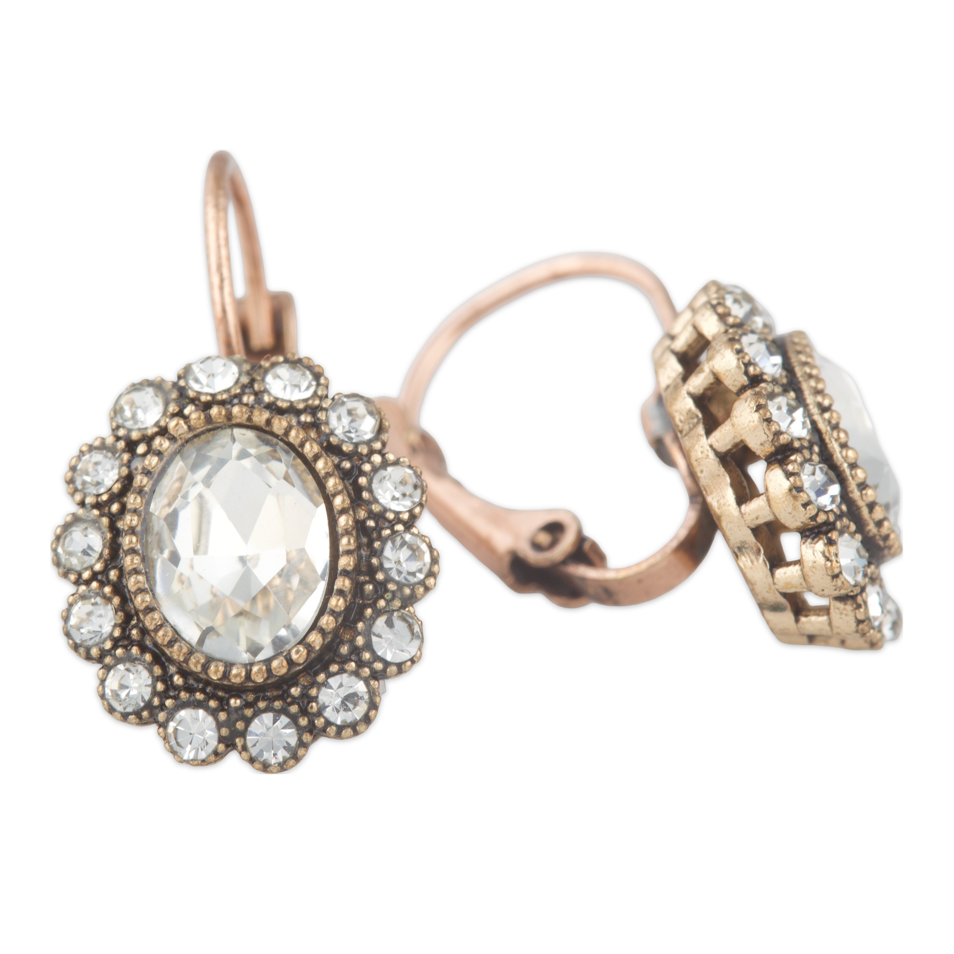 Pair of ornate earrings with intricate designs on a white background