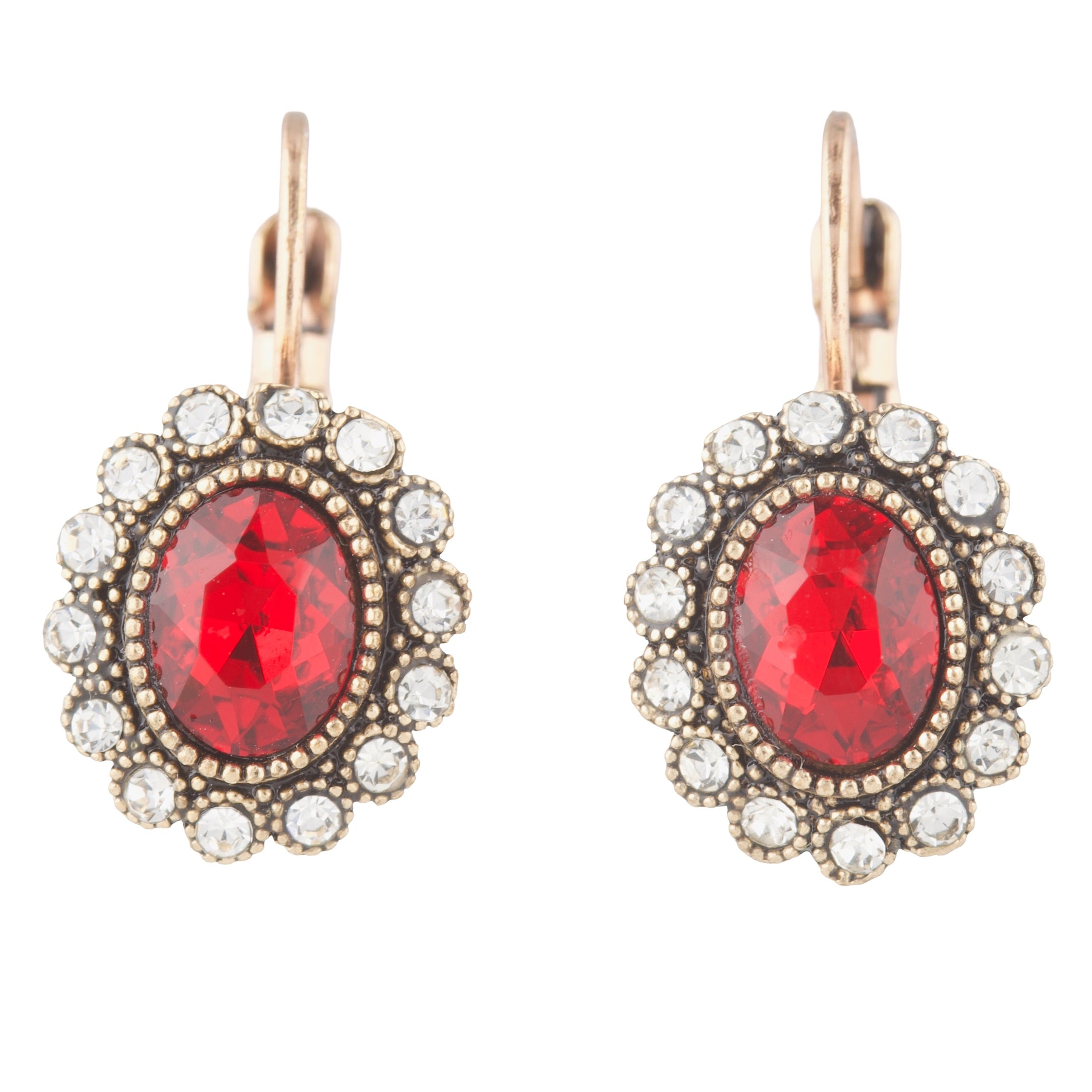 Pair of earrings with red gemstones and rose gold accents on a white background