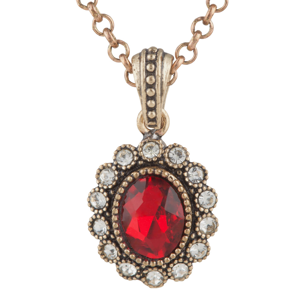 Jewelry pendant with a red gemstone and chain on a white background