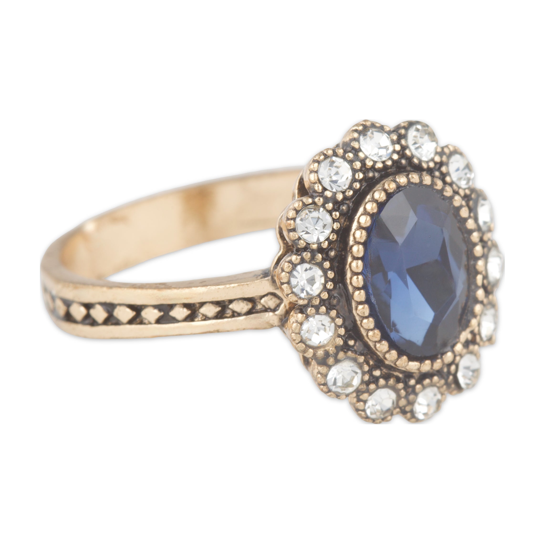 Gold ring with a blue gemstone and diamond accents on a white background
