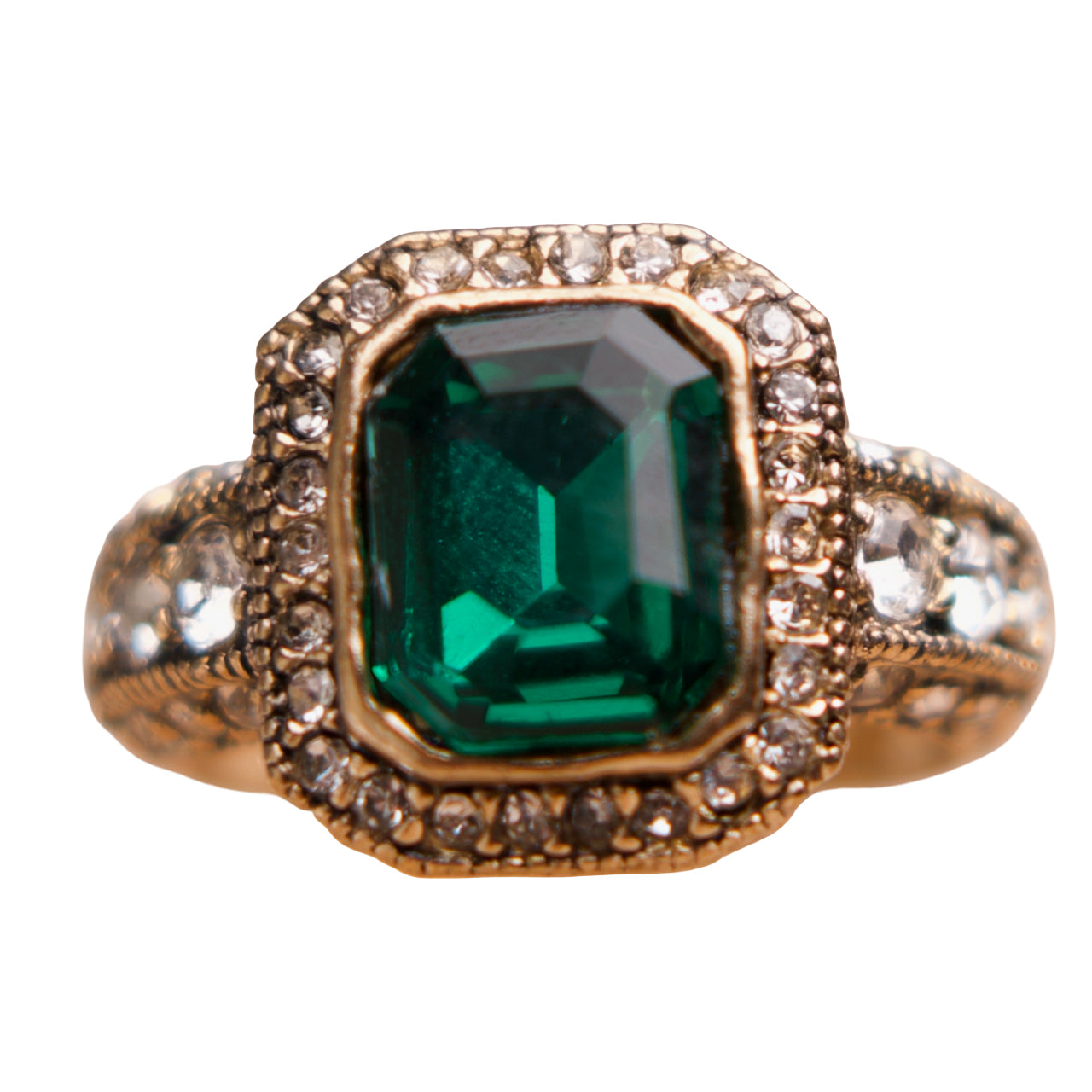 Gold ring with a green gemstone and diamond accents on a white background