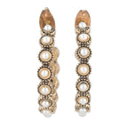 Pair of gold hoop earrings with pearl-like beads on a white background