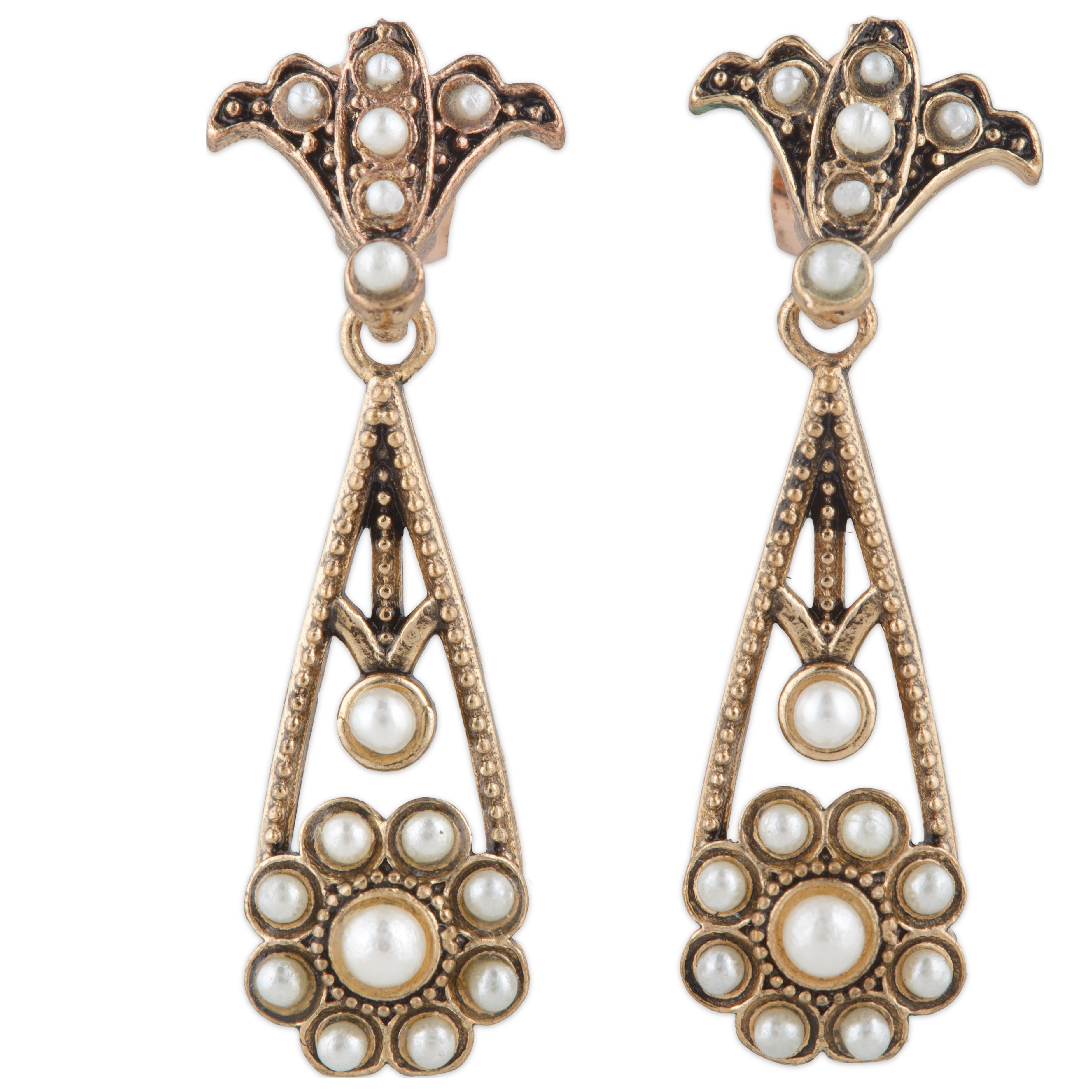 Pair of ornate earrings with pearl-like stones on a white background