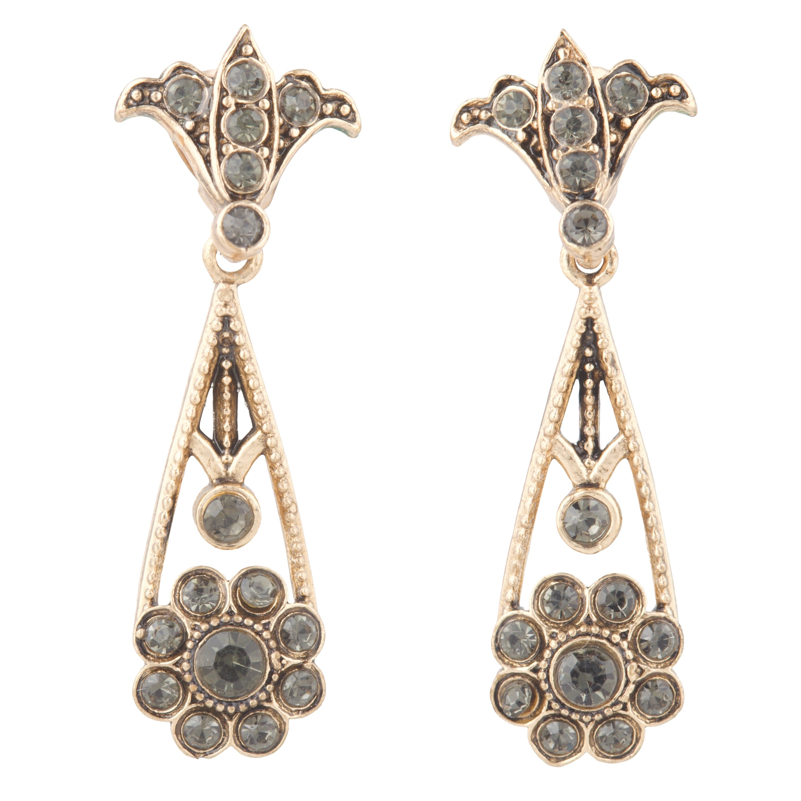 Pair of ornate earrings with gemstones on a white background