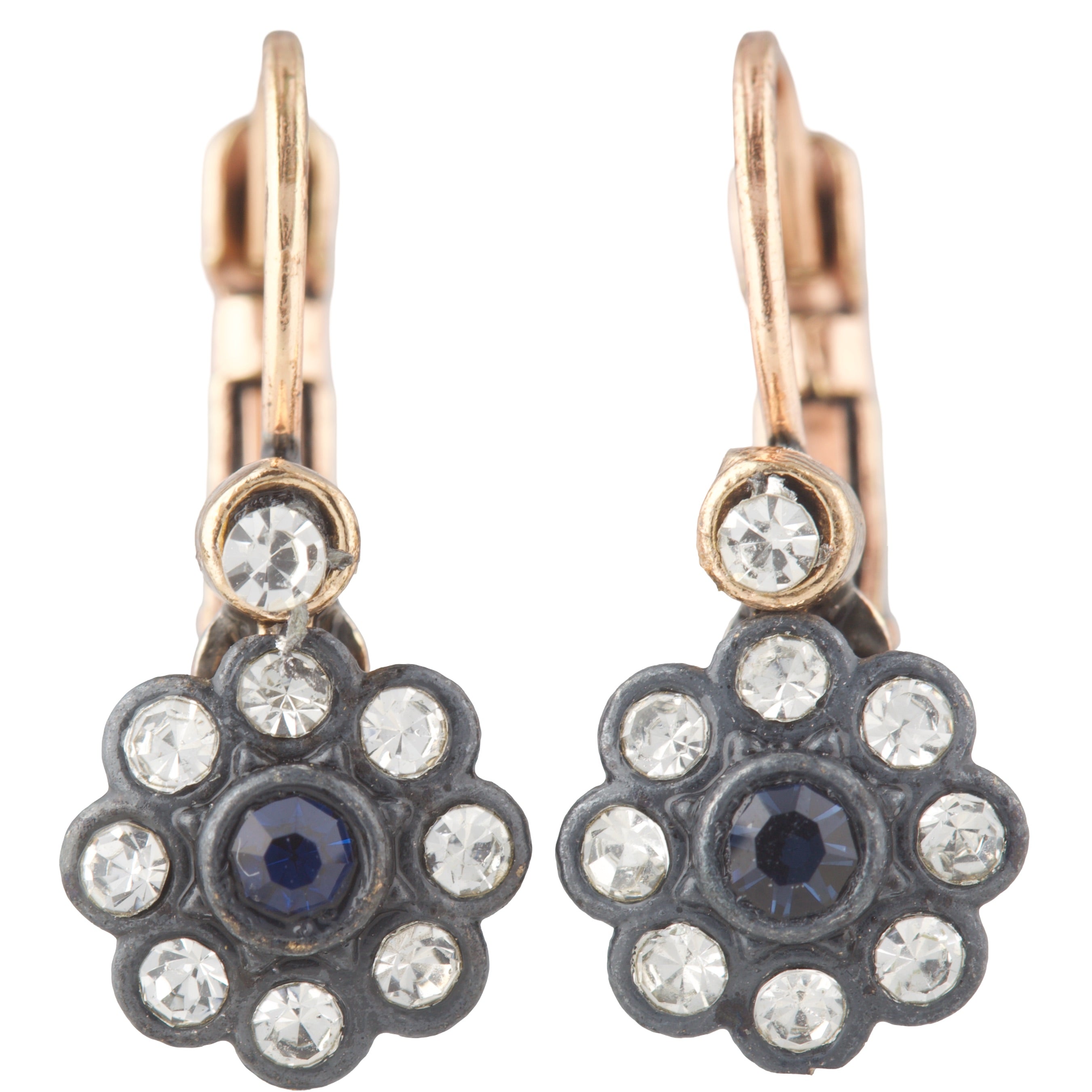 Pair of floral earrings with rose gold, black, and clear gemstones on a white background