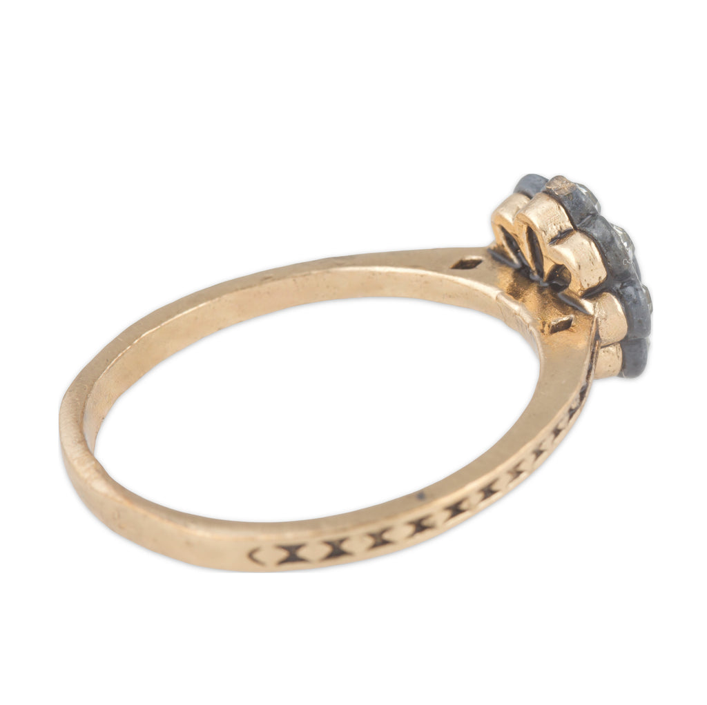 Gold ring with a diamond on a white background