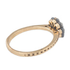 Gold ring with a diamond on a white background