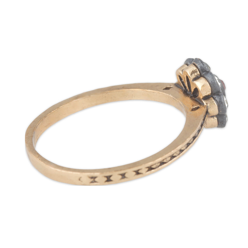 Gold ring with a diamond on a white background
