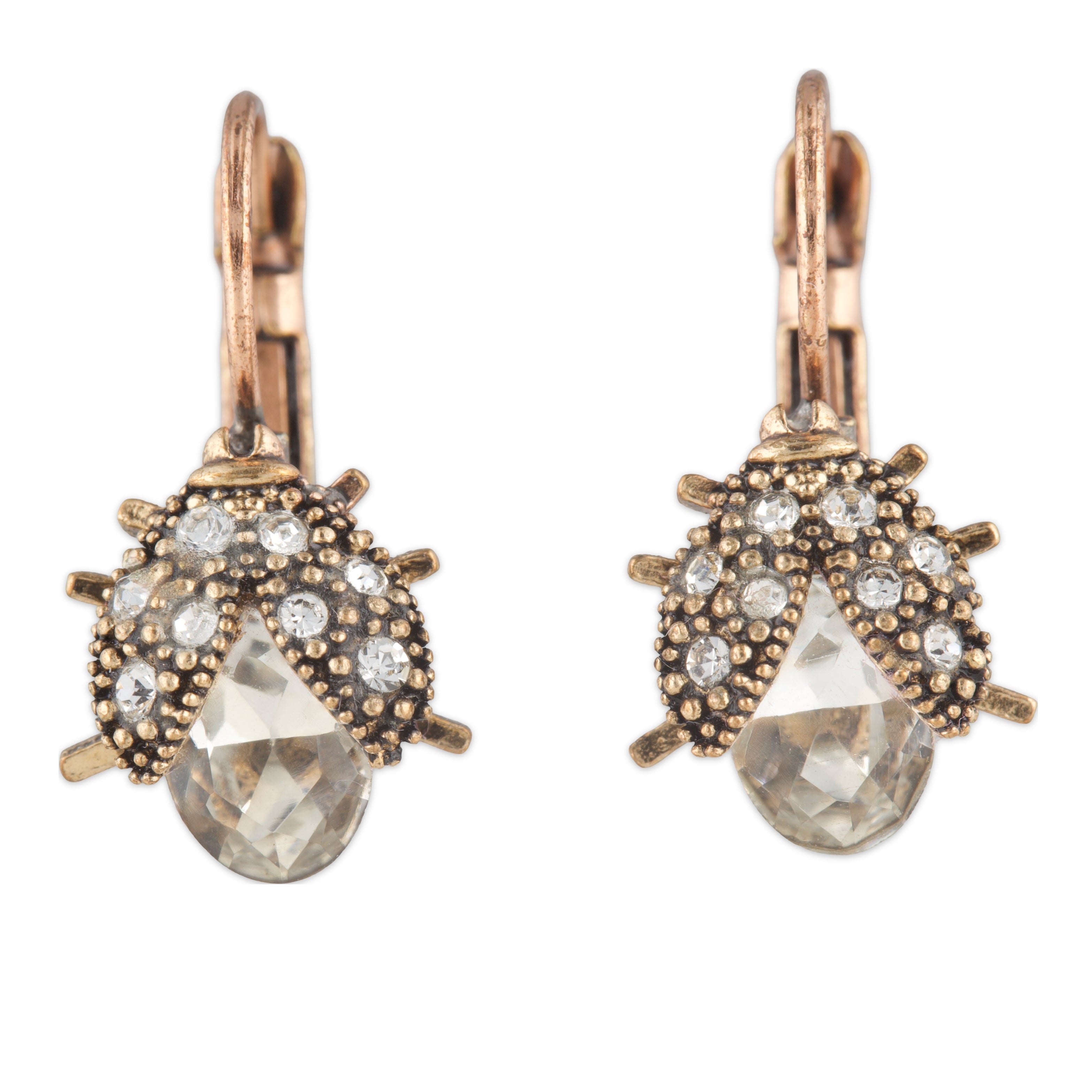 Pair of earrings with rose gold and clear gemstone design on a white background