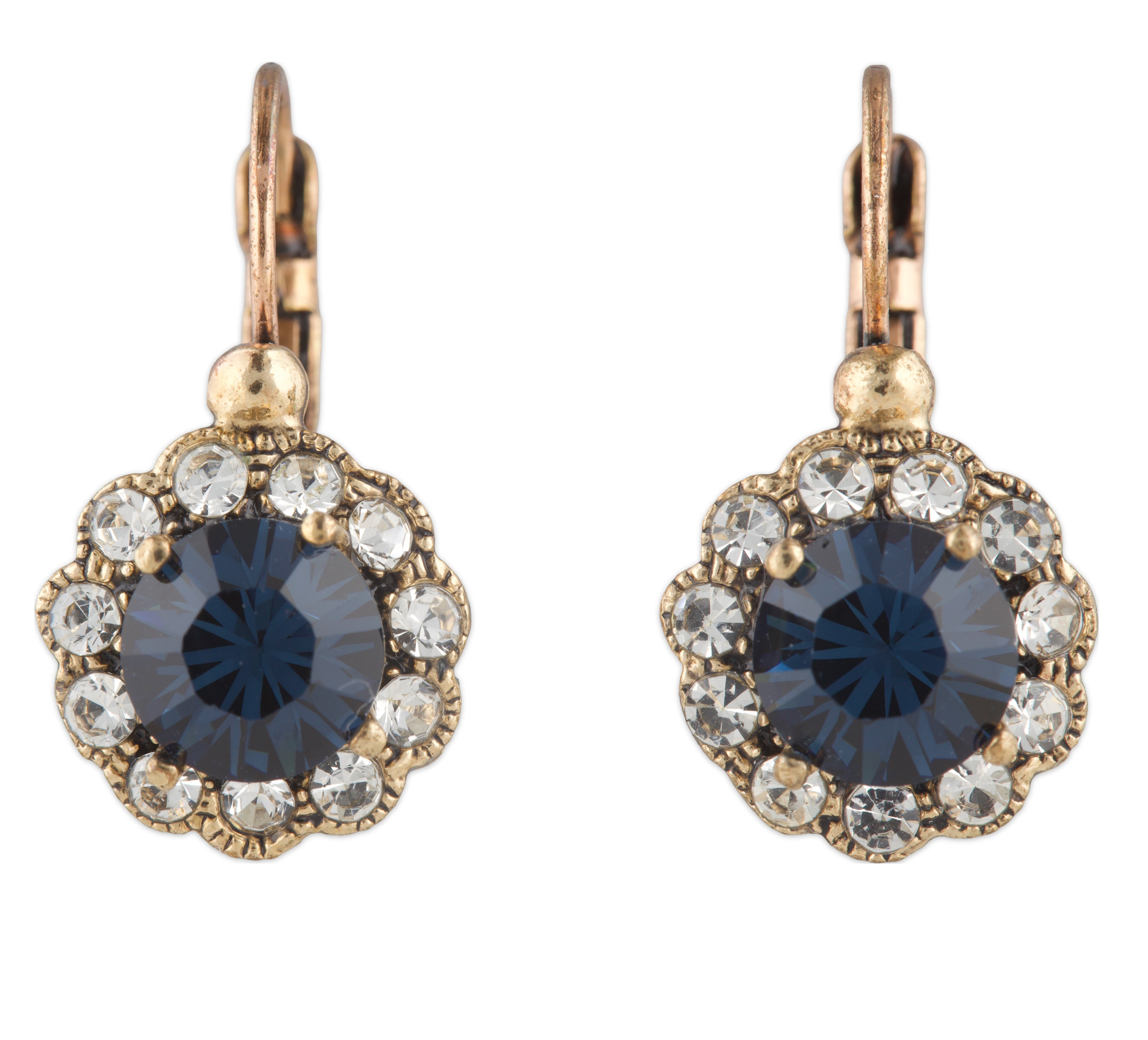 Pair of earrings with blue gemstones and gold accents on a white background