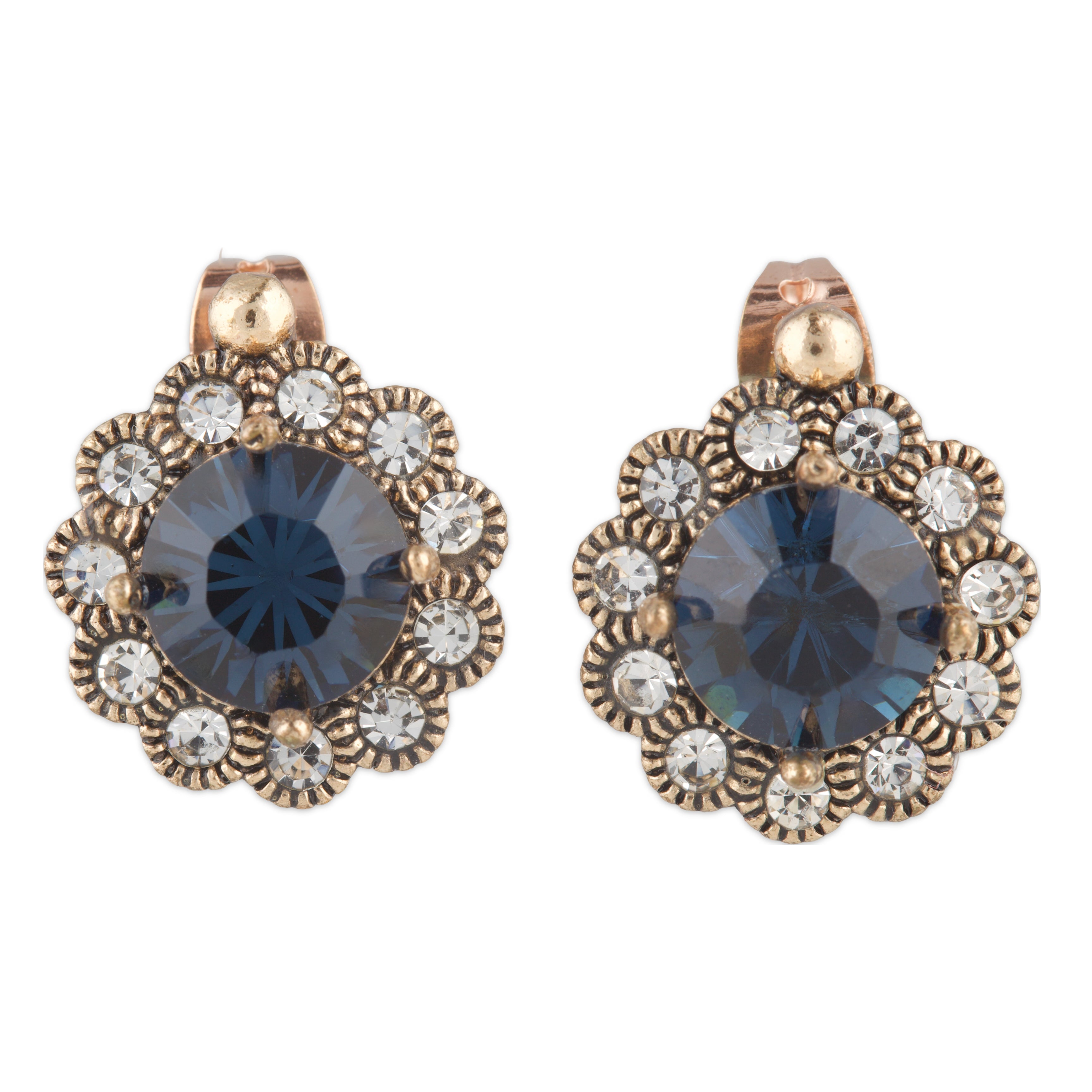Pair of ornate earrings with blue gemstones and gold accents on a white background
