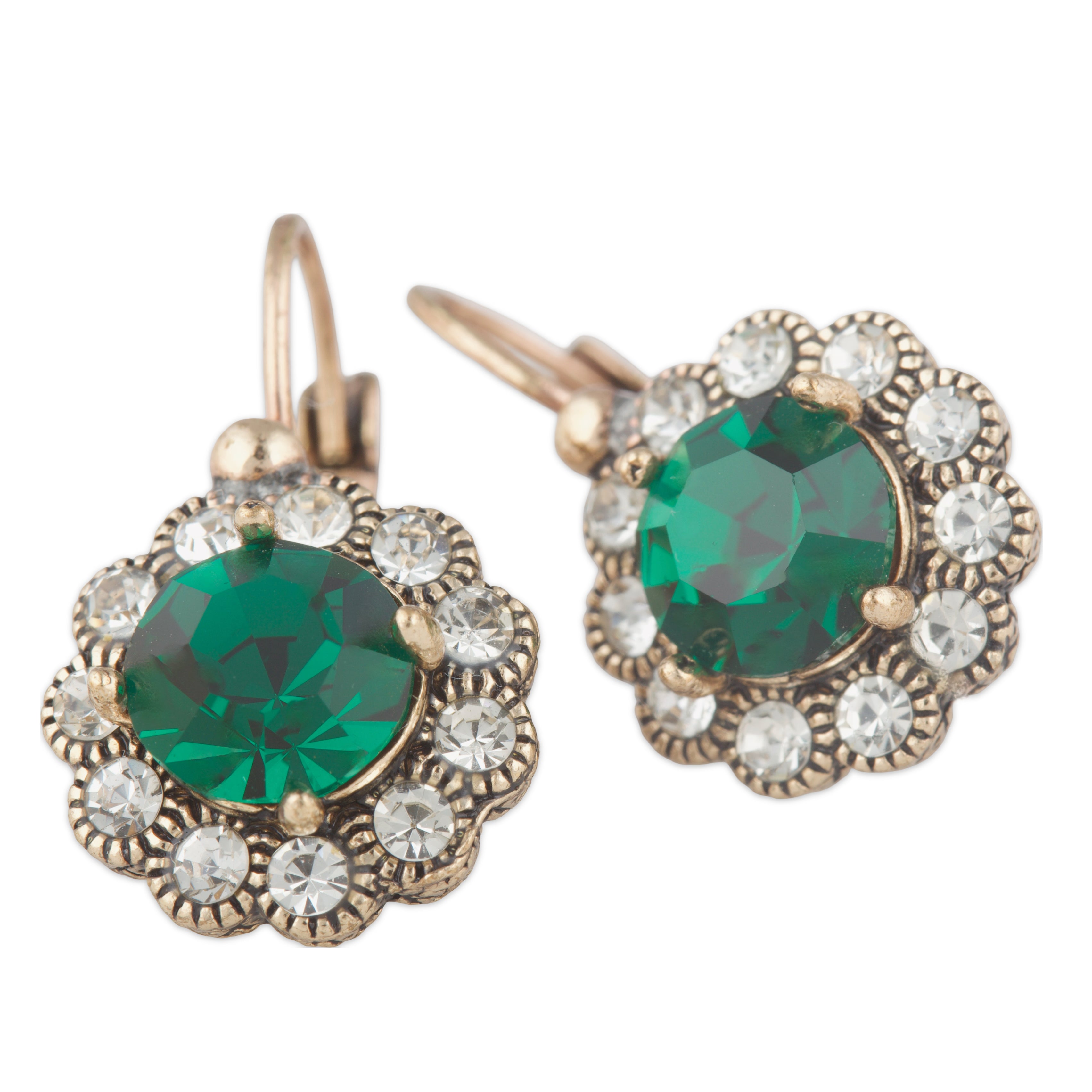 Pair of earrings with green gemstones and gold accents on a white background