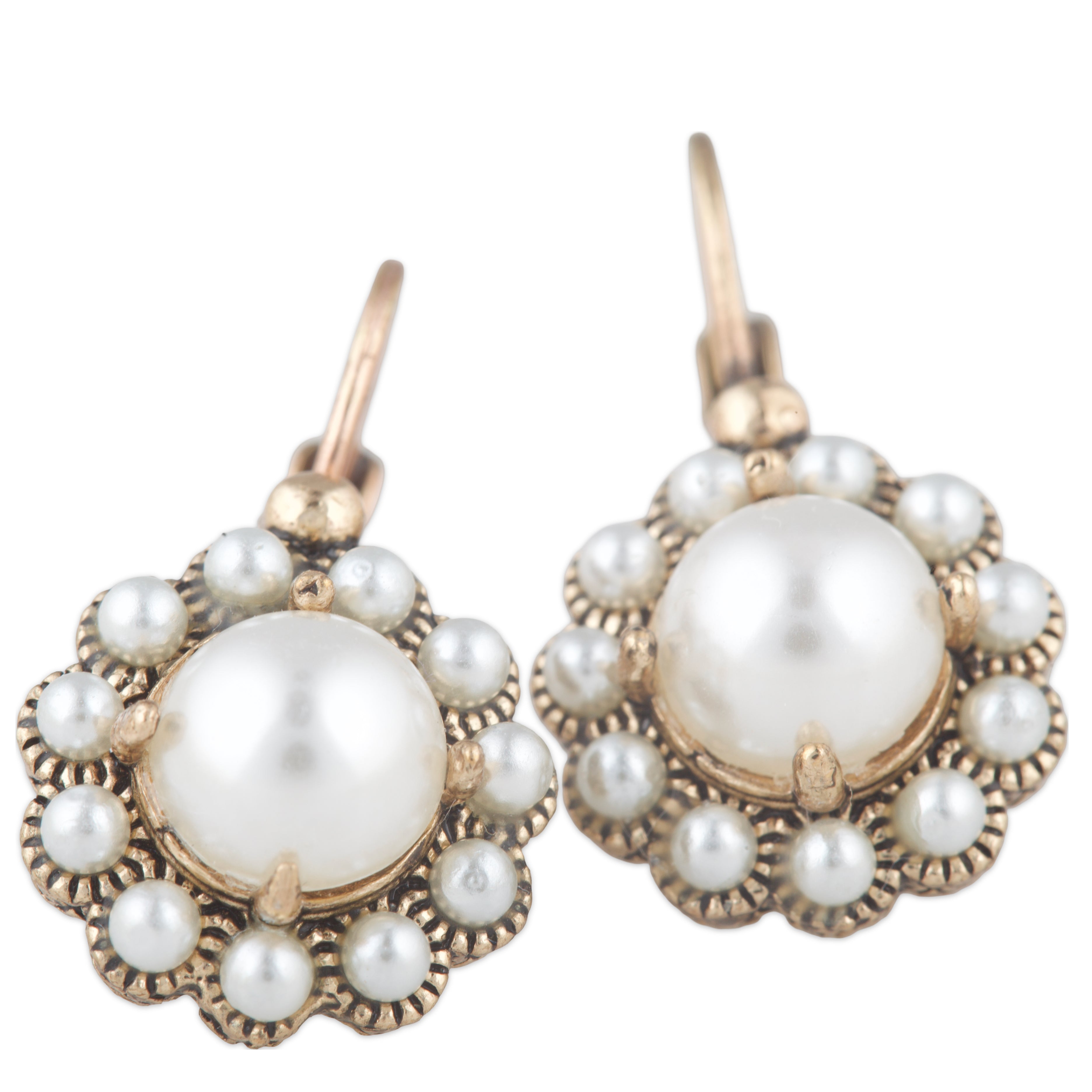 Pair of pearl earrings with gold accents on a white background