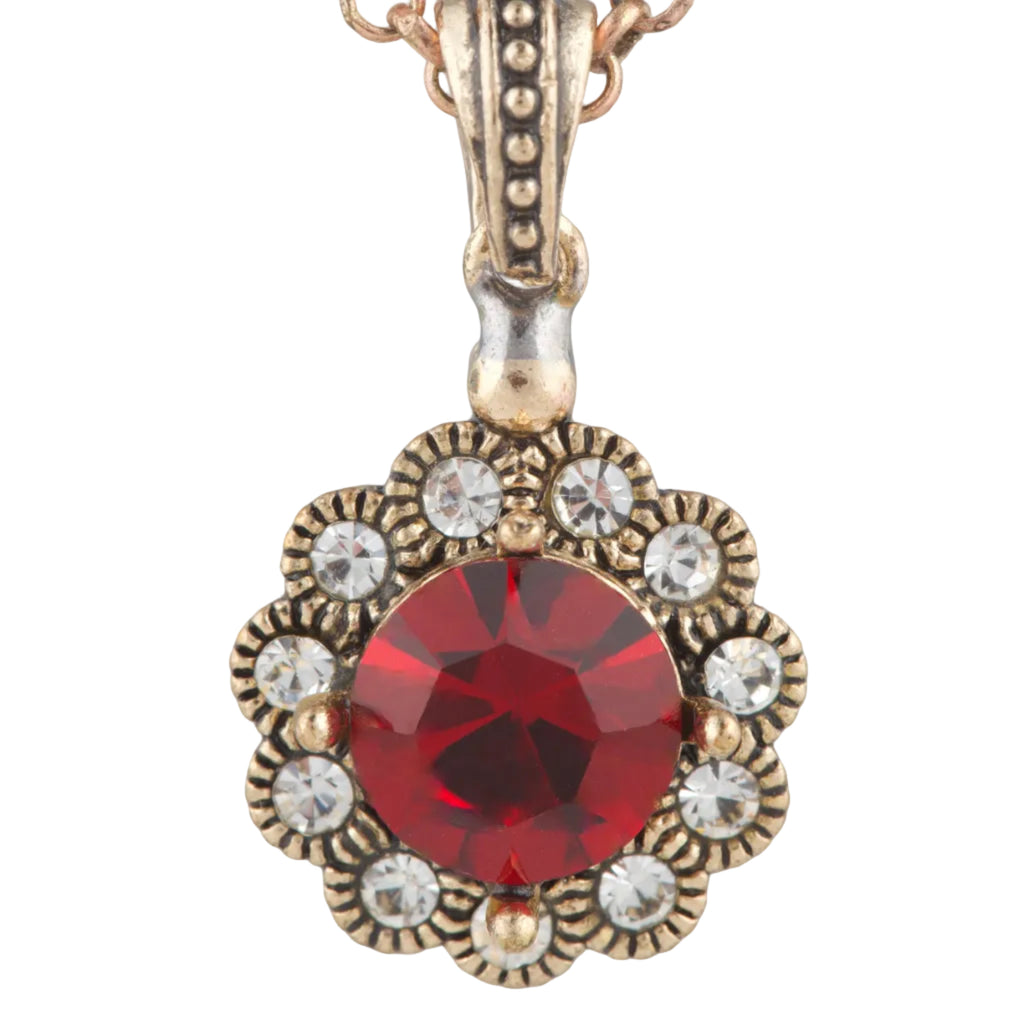 Necklace with a red gemstone pendant on a white background