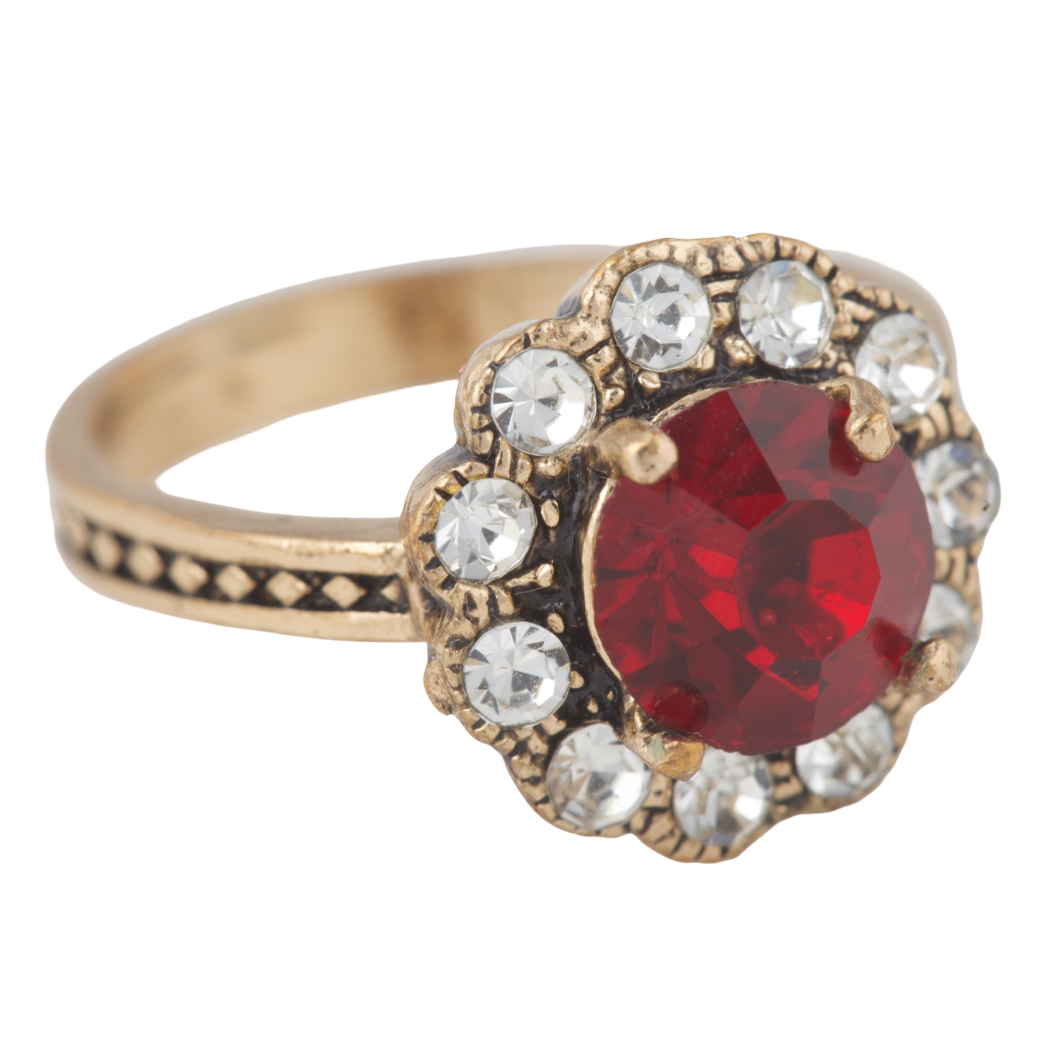 Gold ring with a red gemstone and clear stones on a white background