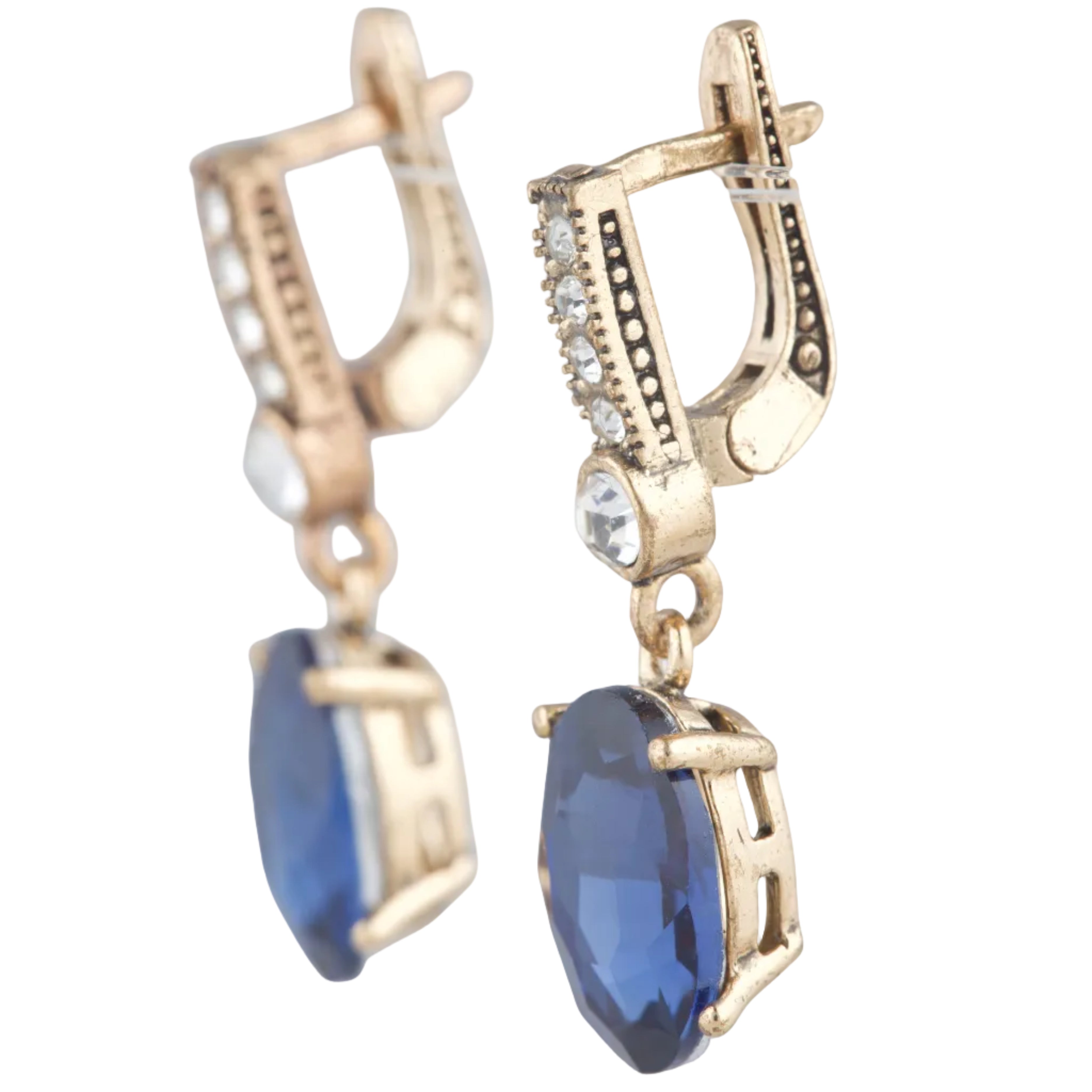 Gold earrings with blue gemstones on a white background