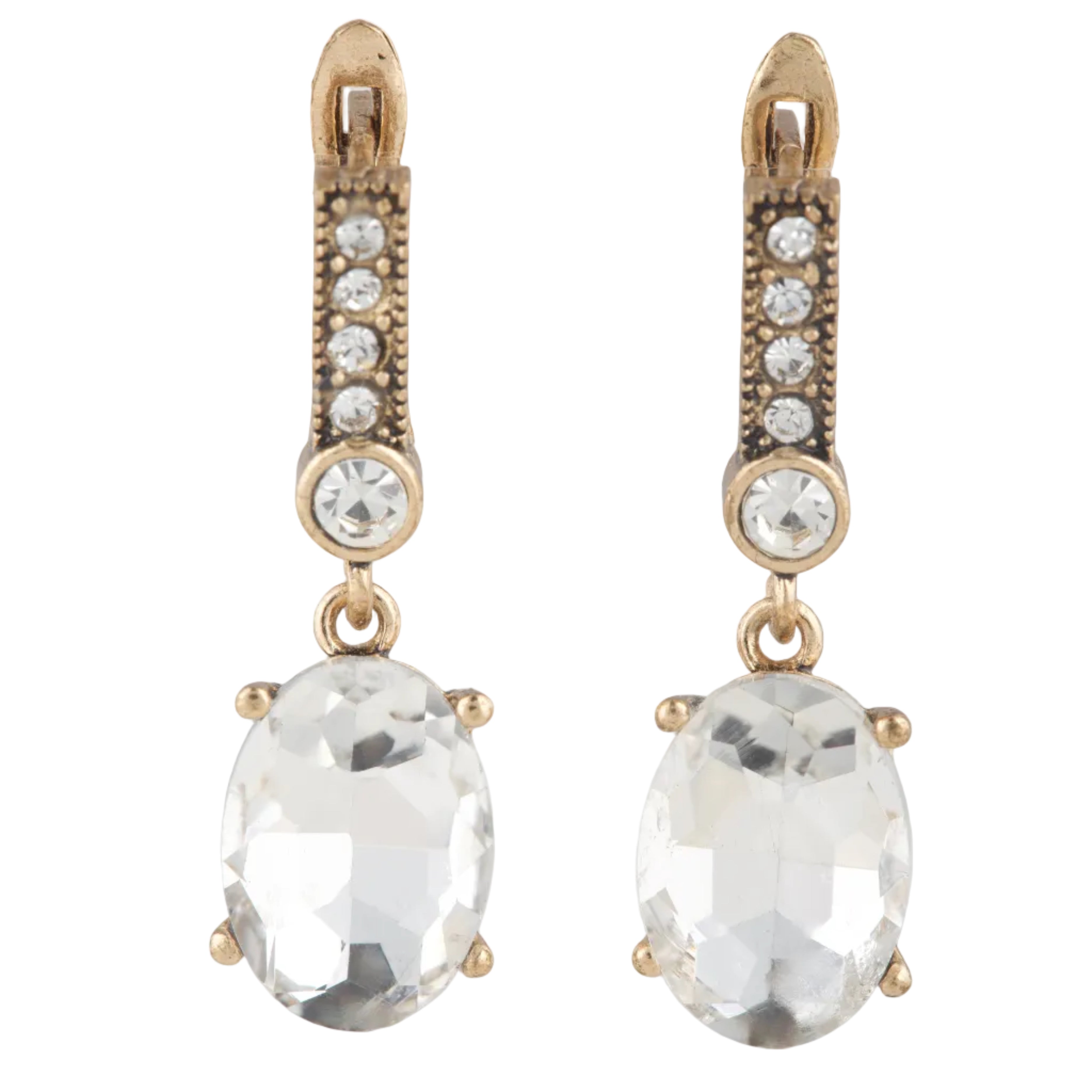 Pair of gold earrings with clear gemstones on a white background