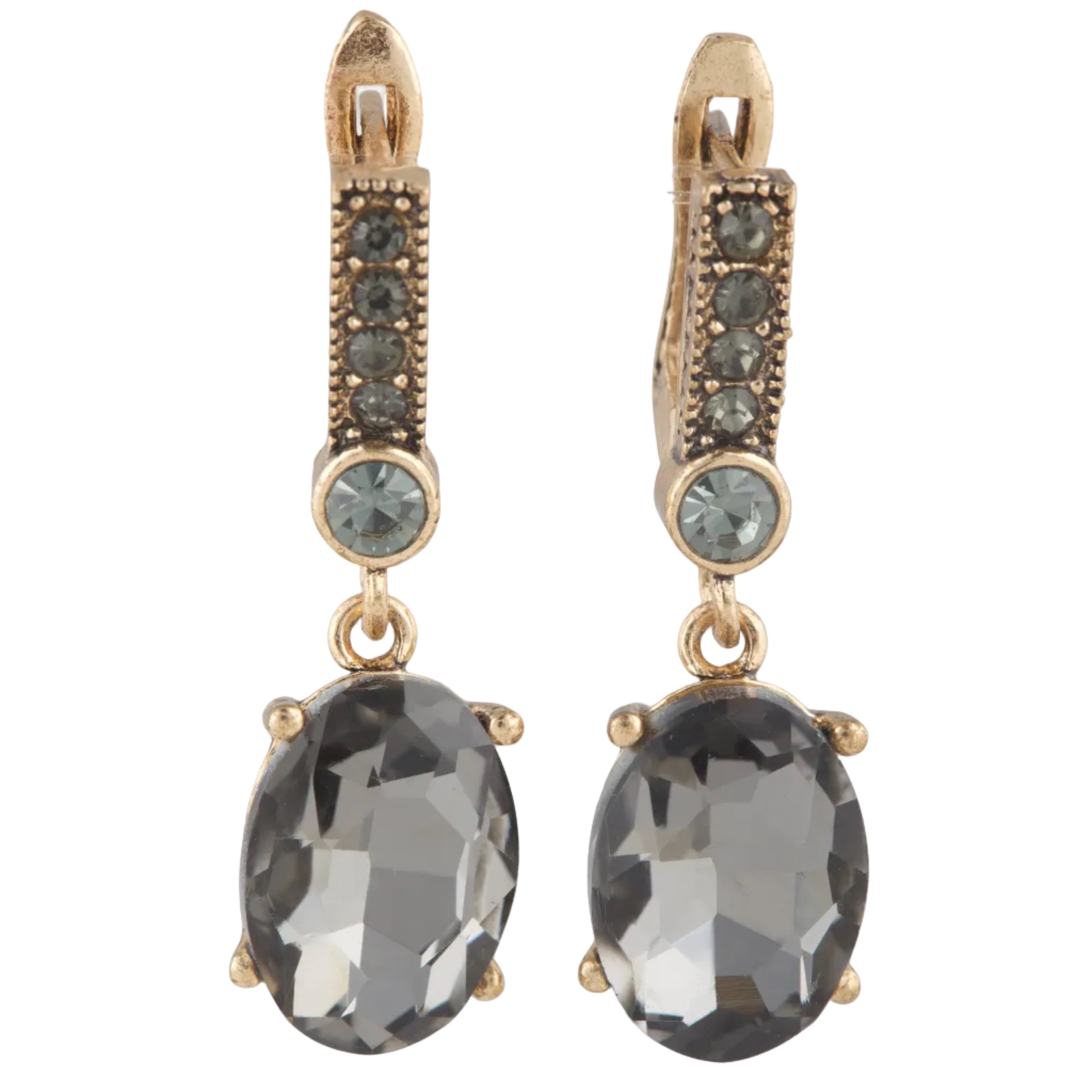 Gold earrings with dark gemstones on a white background