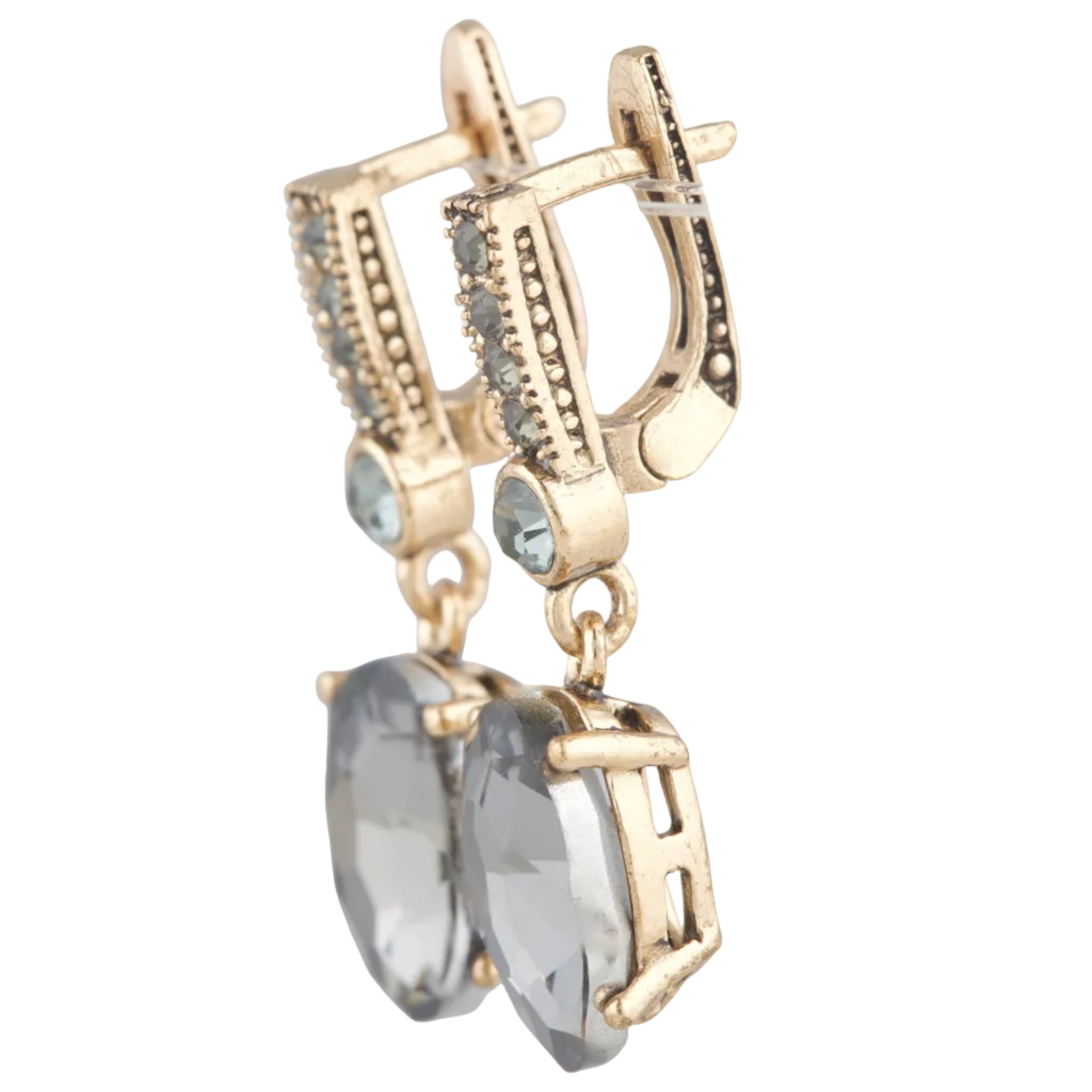 Gold earrings with gemstones on a white background
