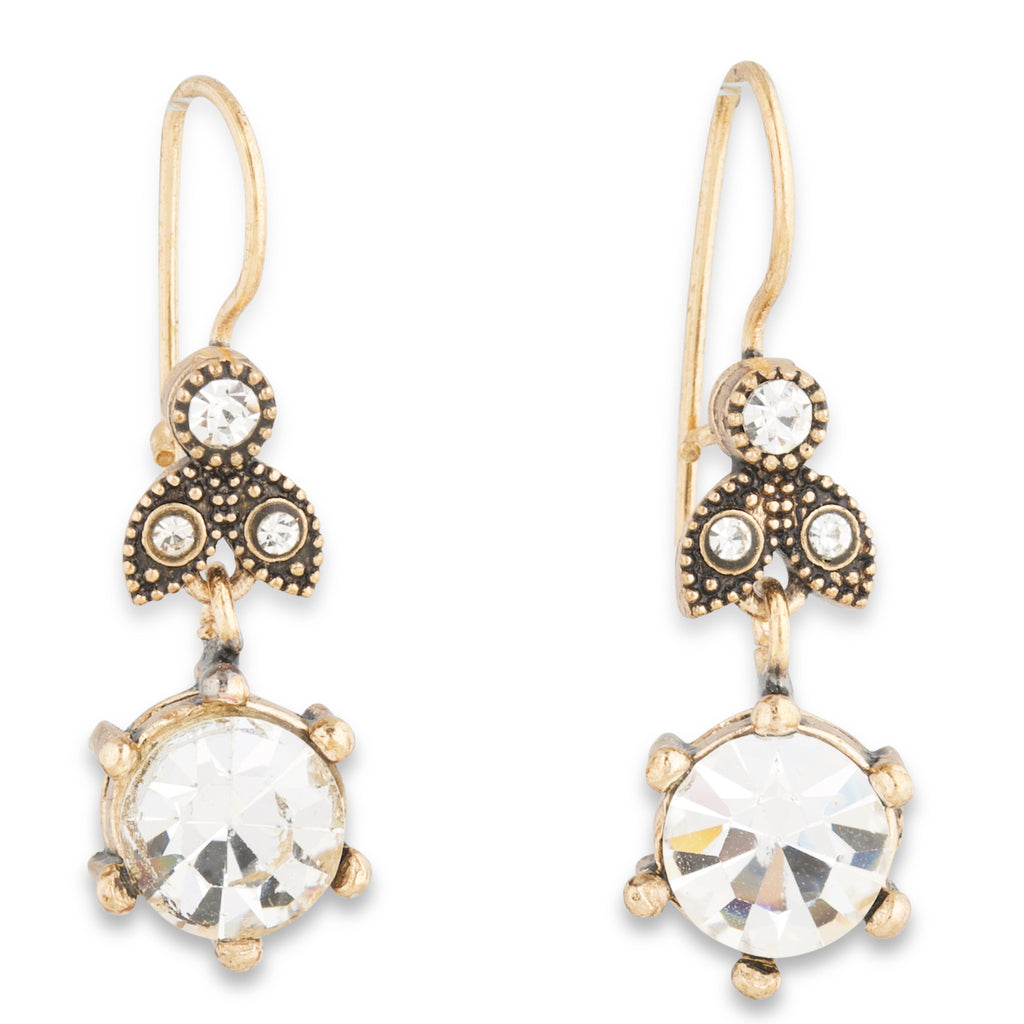 Gold and crystal drop earrings on a white background