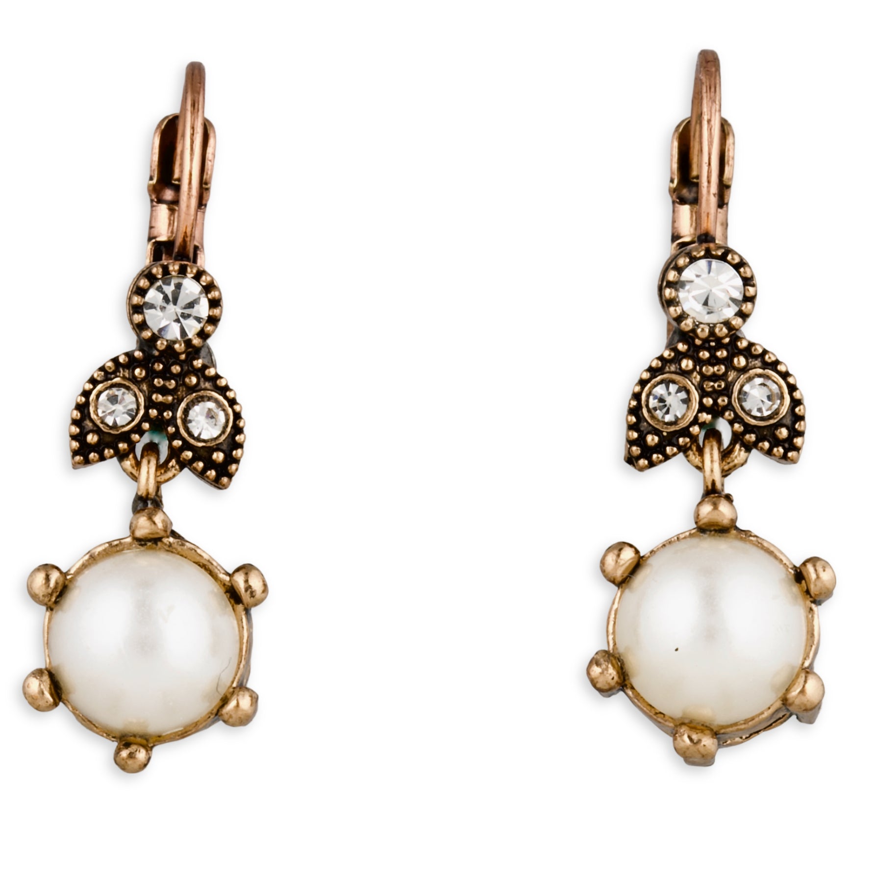 Pair of ornate earrings with pearl-like centers and crystal accents on a white background