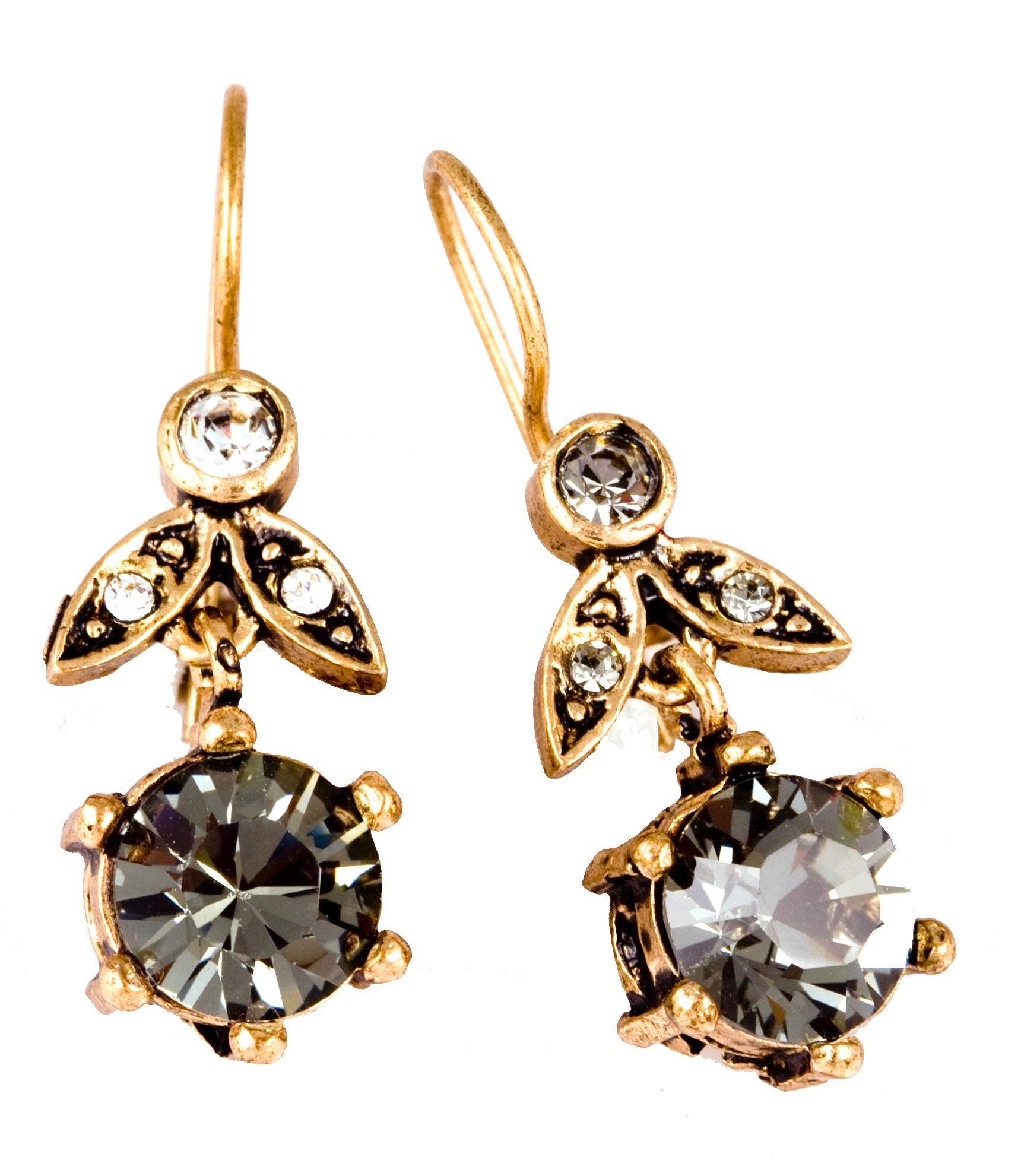 Gold earrings with large round gemstones on a white background