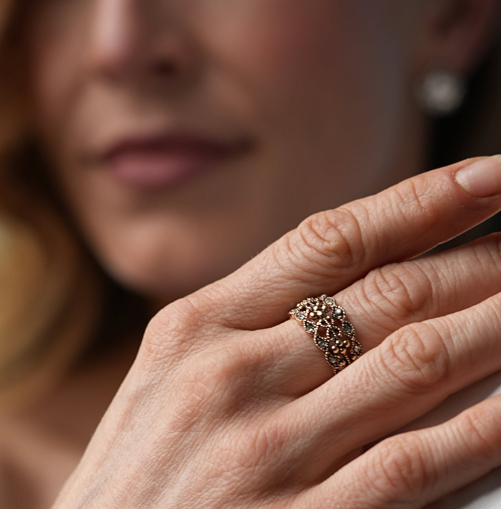 Woman wearing a ring on her hand with a blurred background