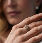Woman wearing a ring on her hand with a blurred background