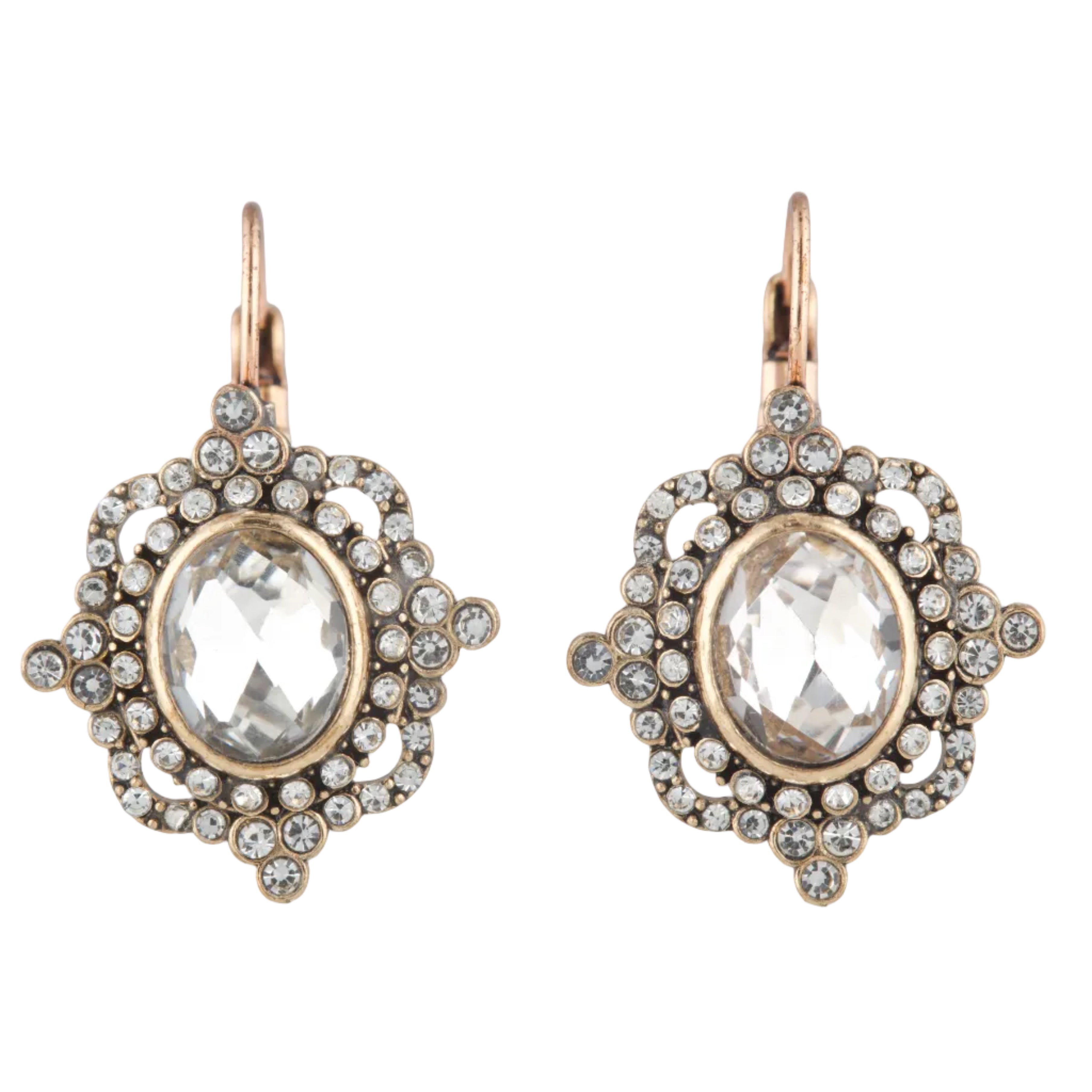 Pair of ornate earrings with clear gemstones and gold accents on a white background