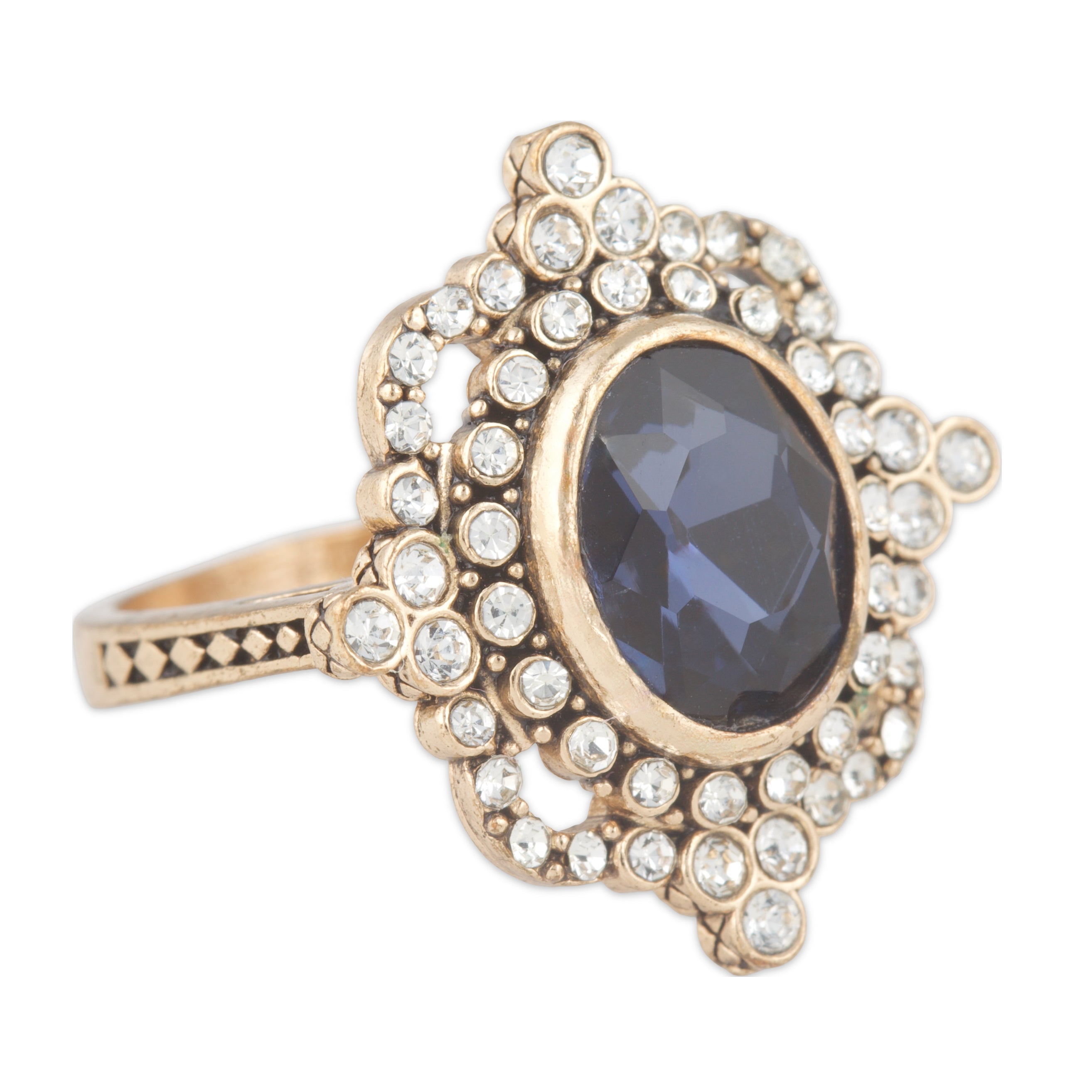 Elegant ring with a dark gemstone and gold accents on a white background