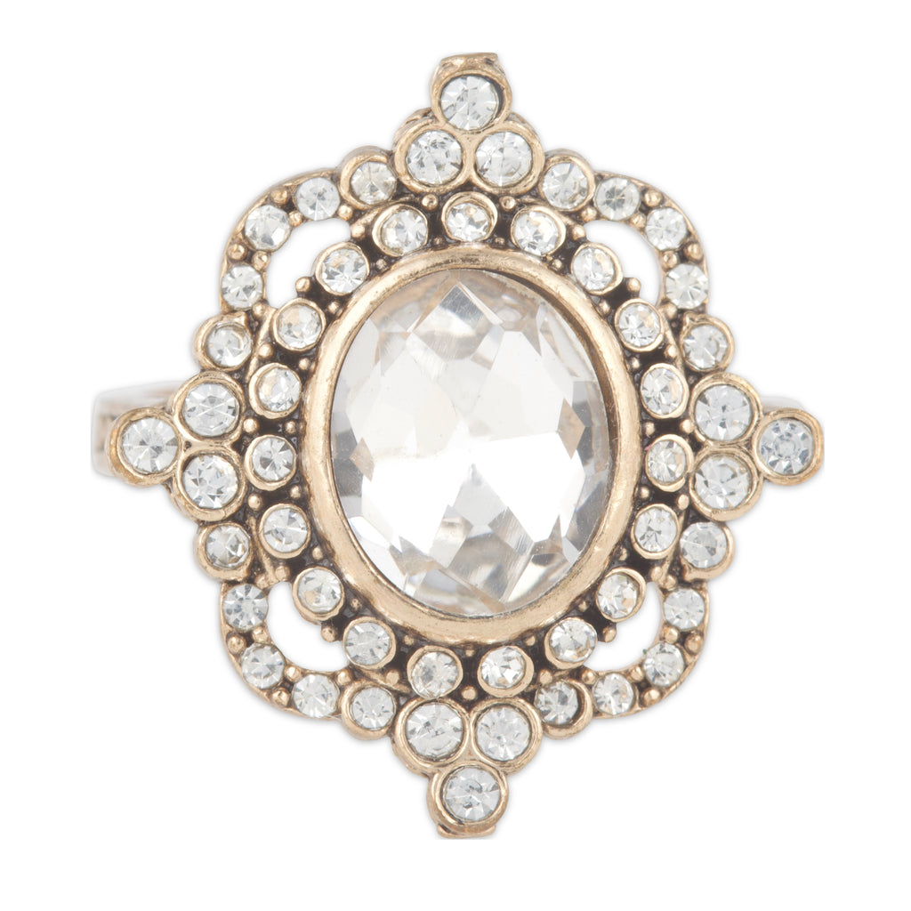 Decorative ring with a central gemstone and surrounding crystals on a white background