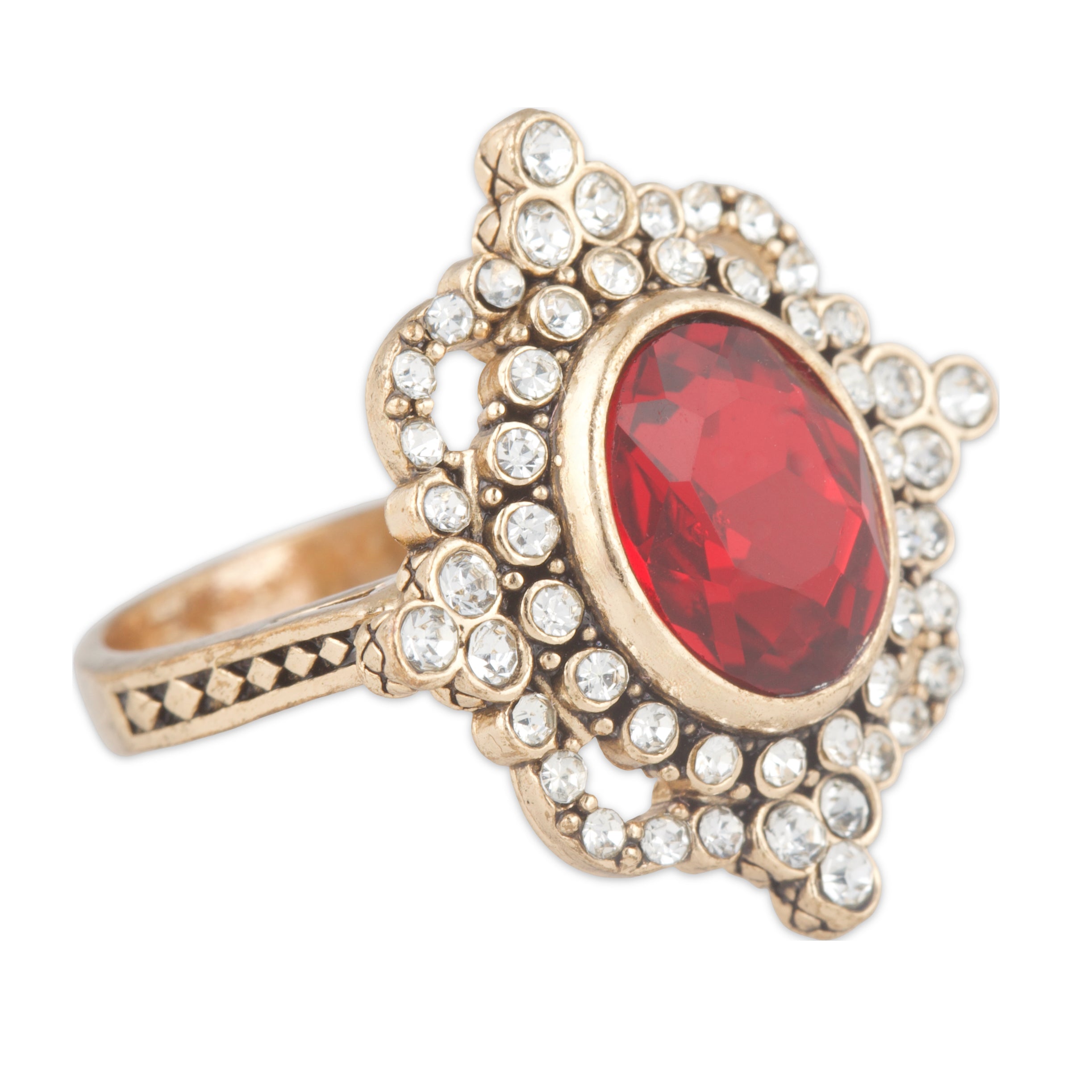 Gold ring with a red gemstone and clear stones on a white background