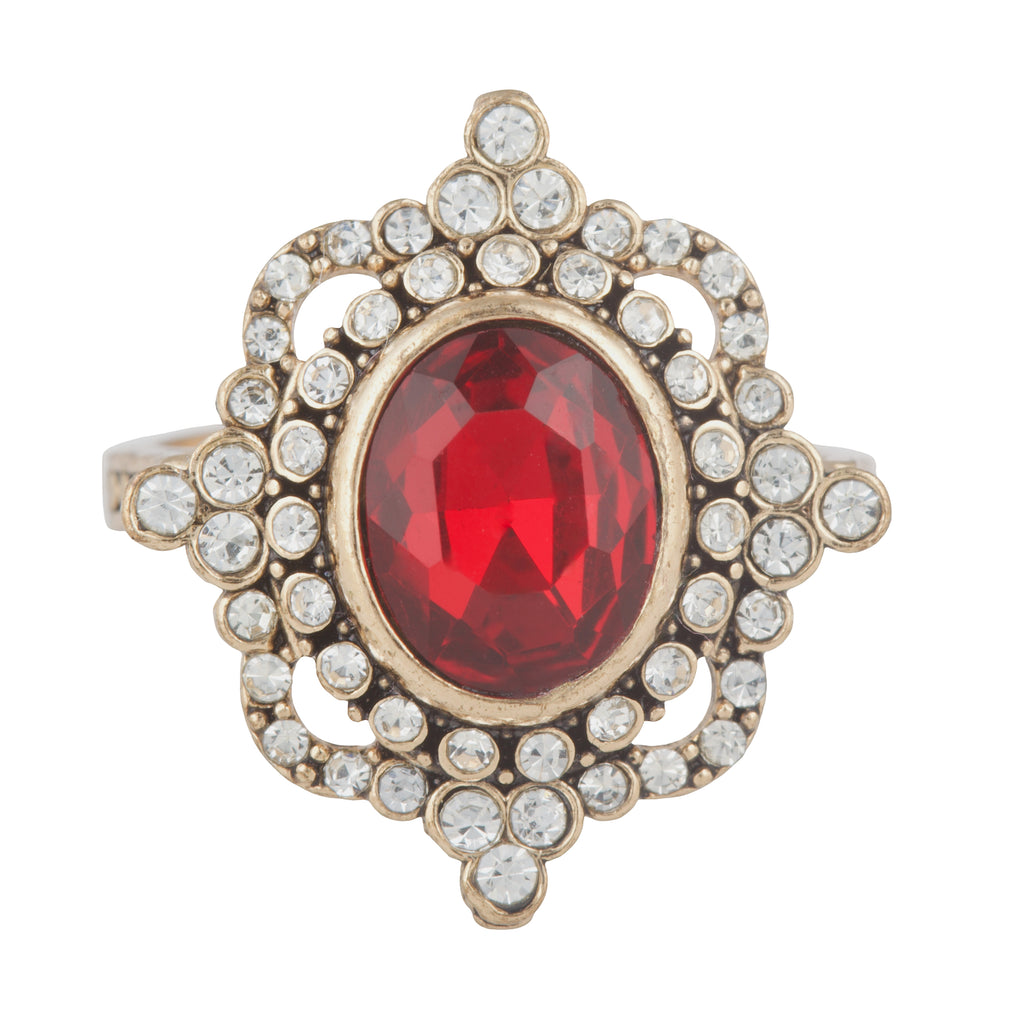 Ring with a red gemstone and gold accents on a white background