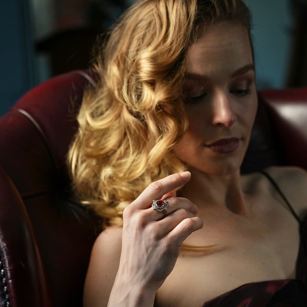 Woman holding a ring in a dimly lit room
