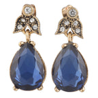 Pair of gold and blue teardrop earrings on a white background