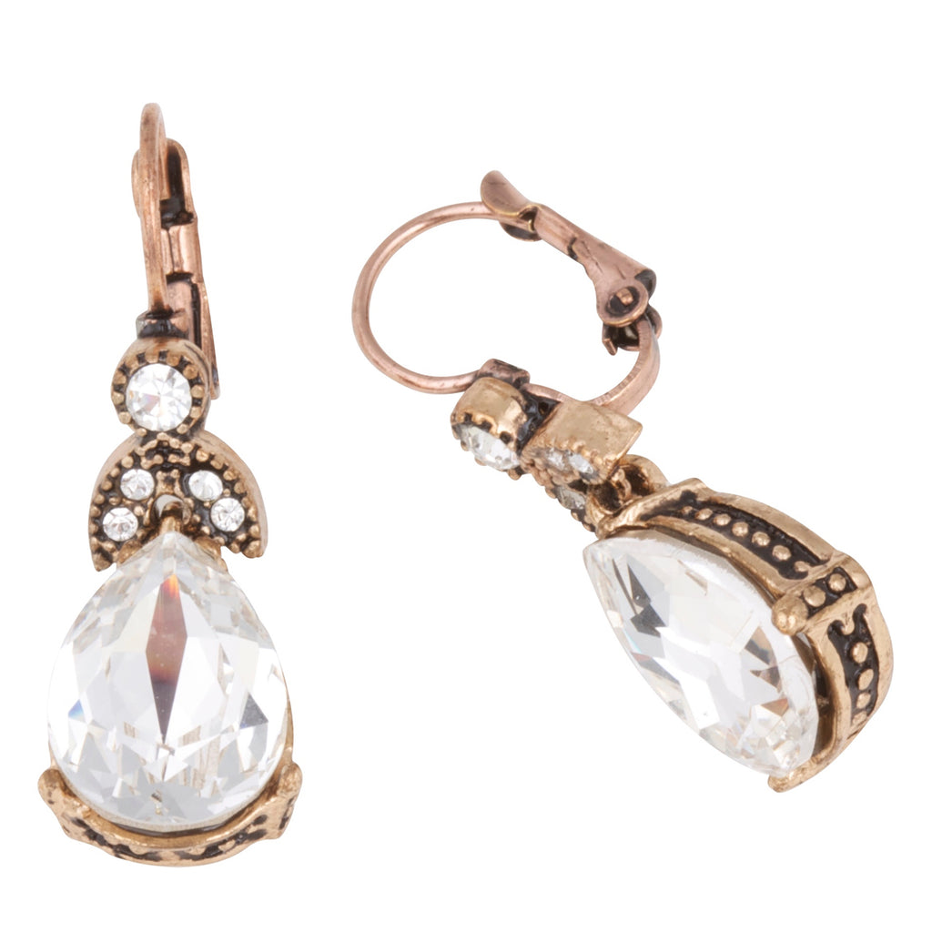 Pair of earrings with teardrop-shaped crystals on a white background