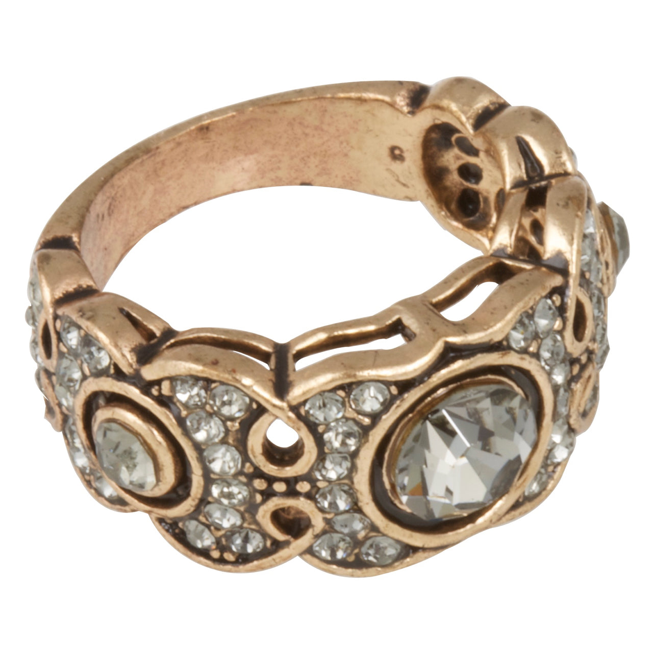 Decorative ring with rose gold band and clear gemstones on a white background