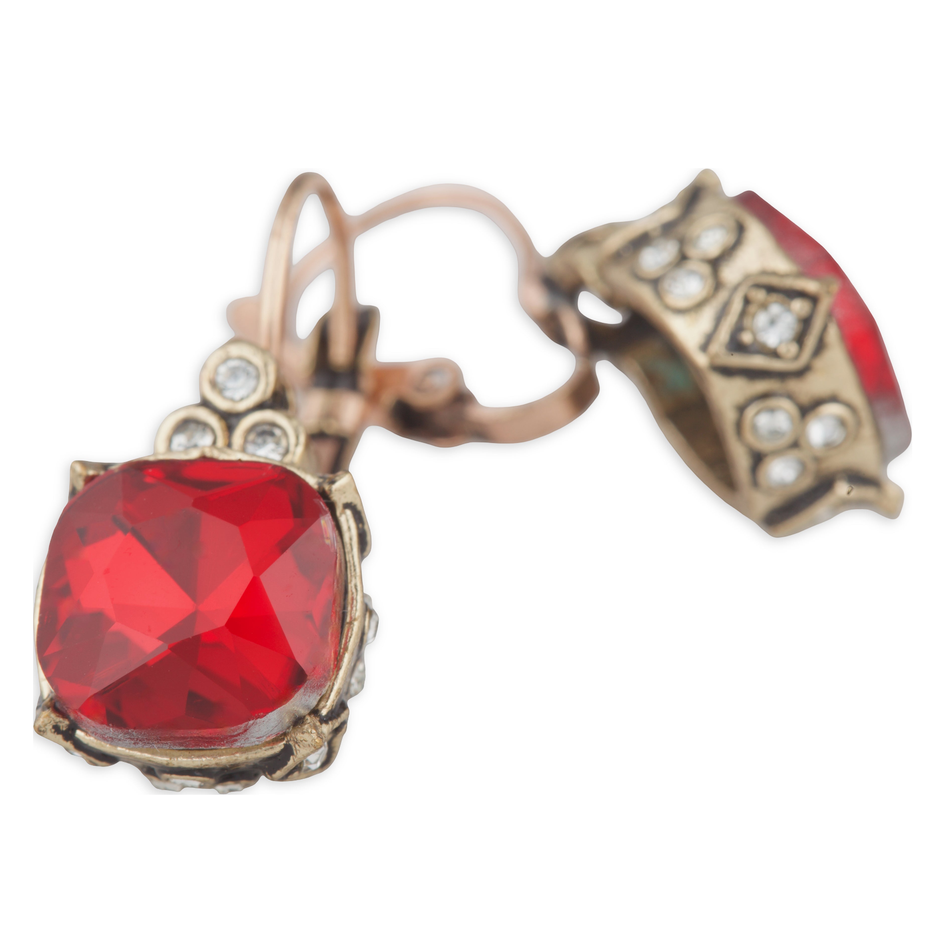 Pair of earrings with red gemstones and gold accents on a white background