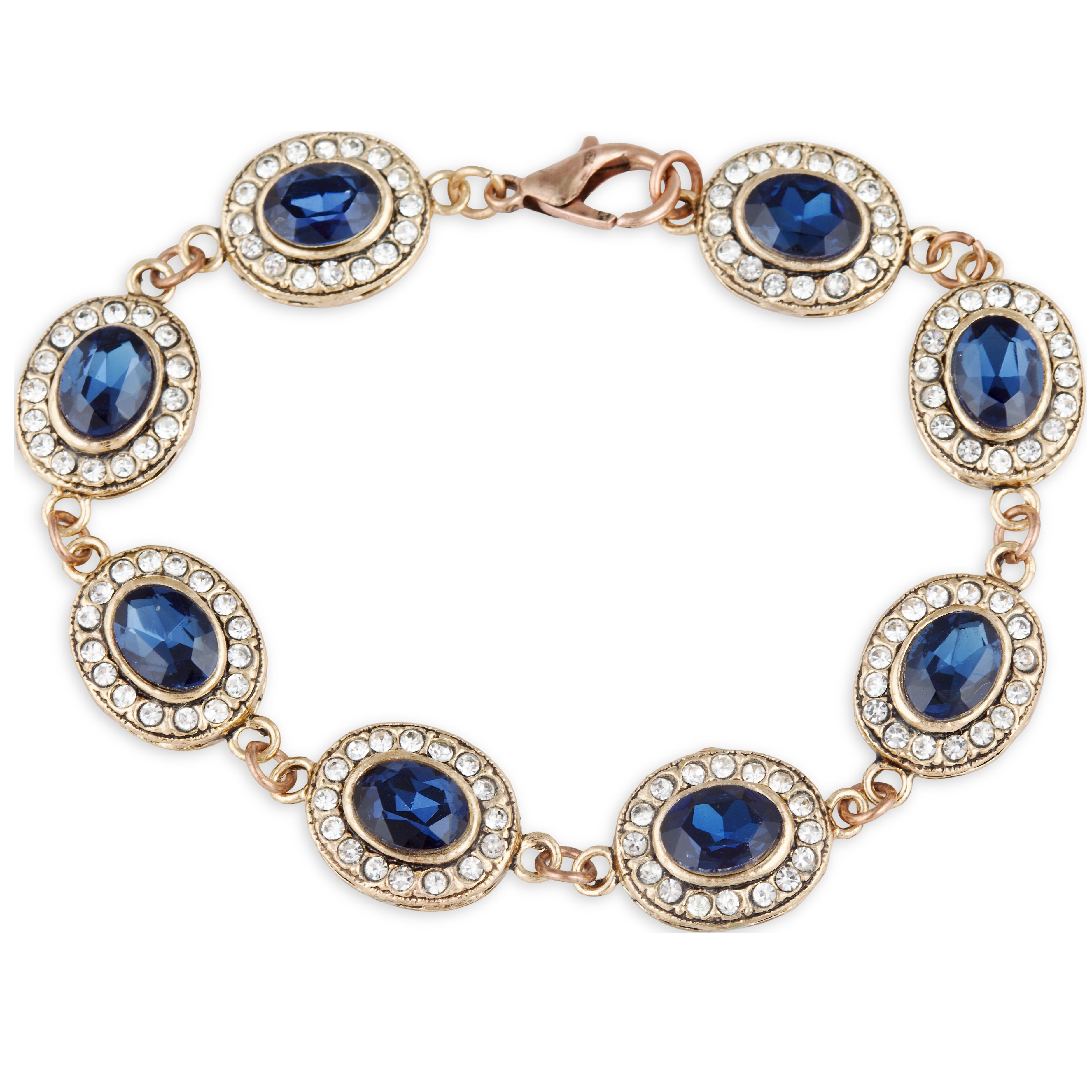 Gold bracelet with blue gemstones on a white background