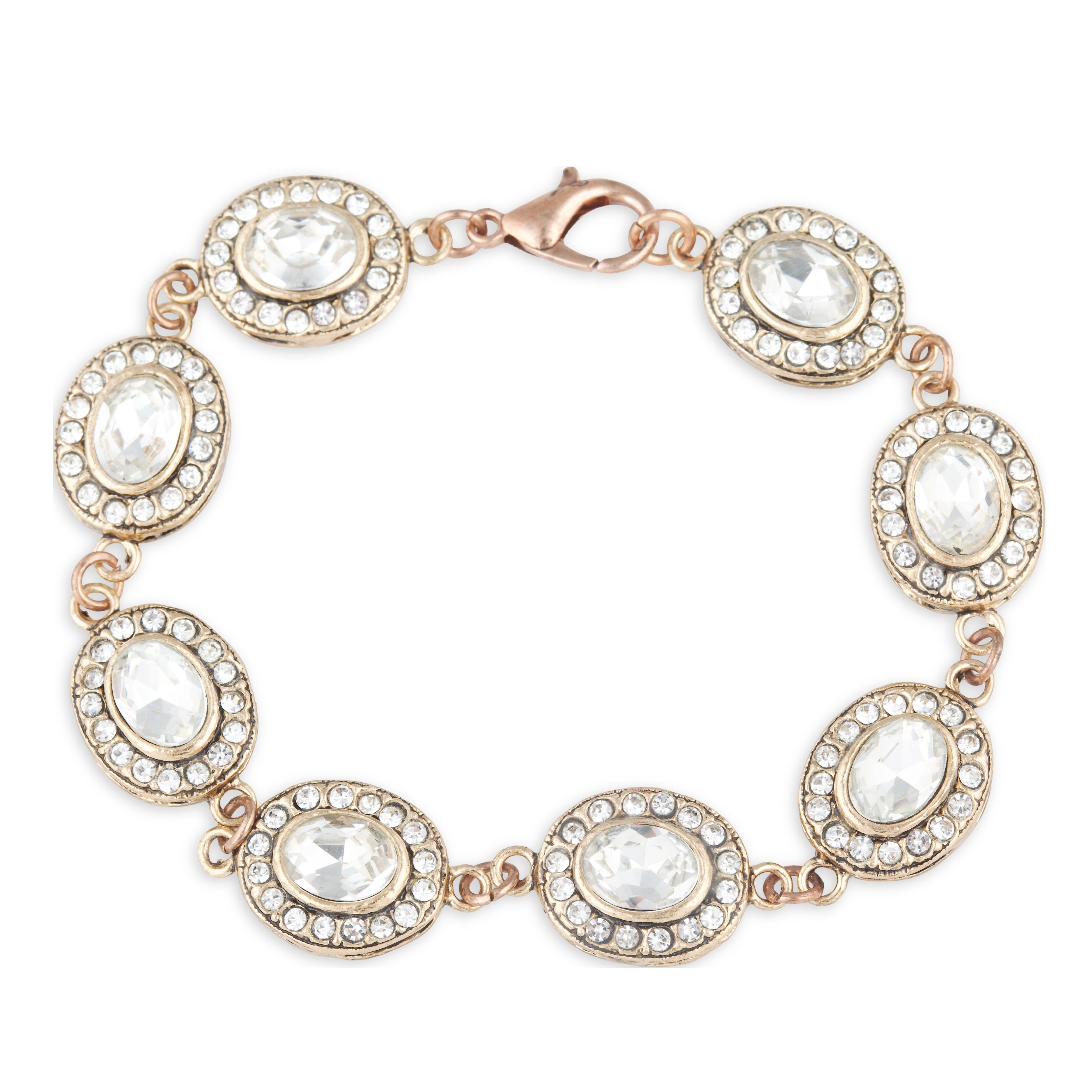 Rose gold bracelet with clear gemstones on a white background