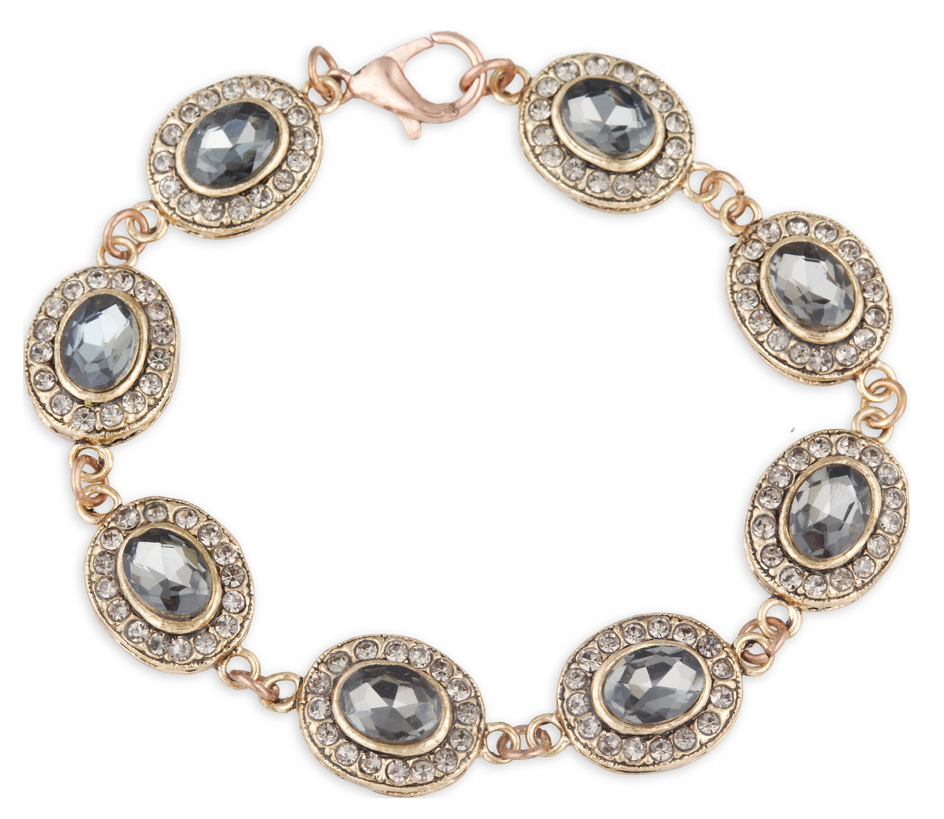 Gold bracelet with gray gemstones on a white background
